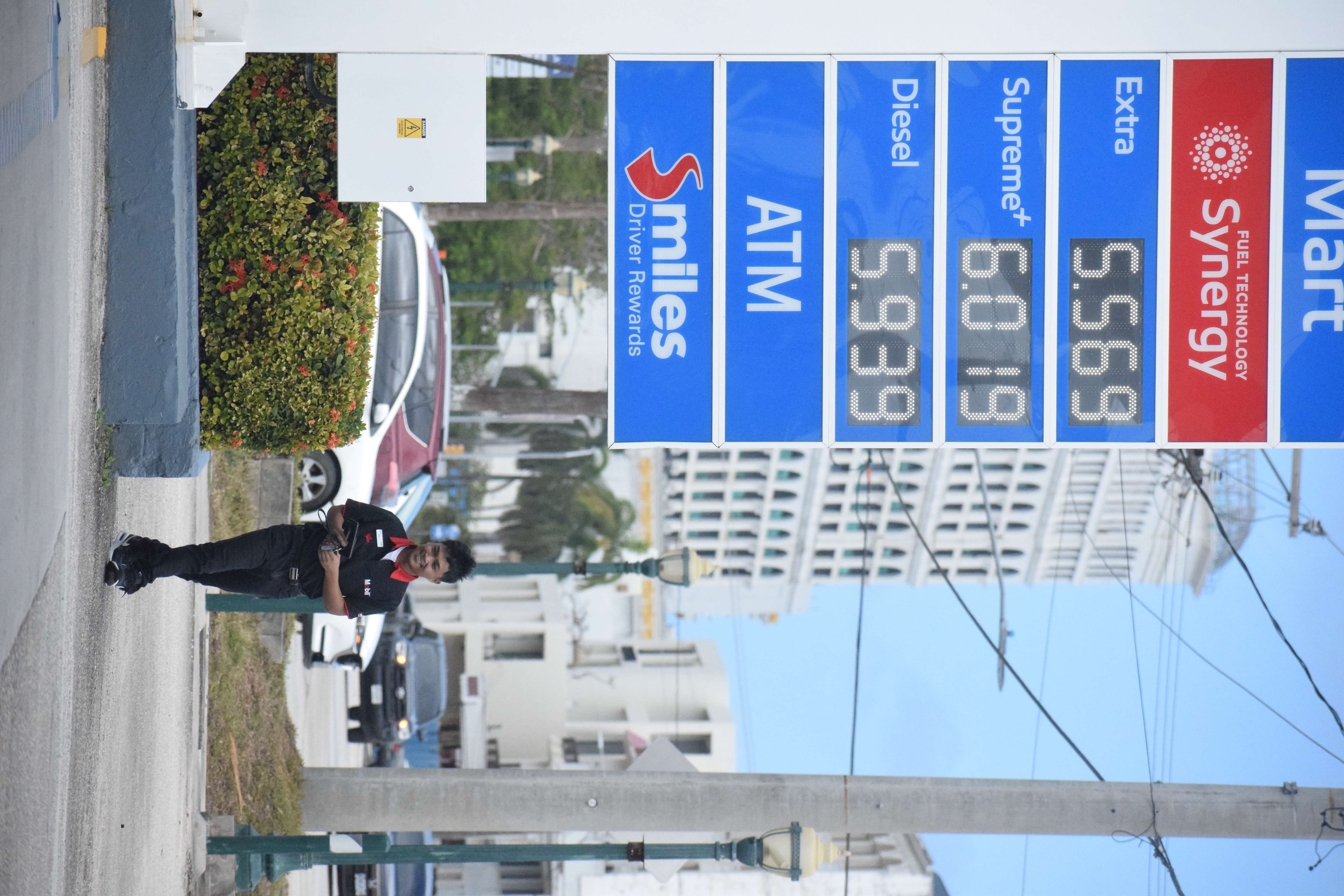 An attendant of Mobil Oil Marianas on Beach Road in Garapan walks back to work after taking a break on Thursday.