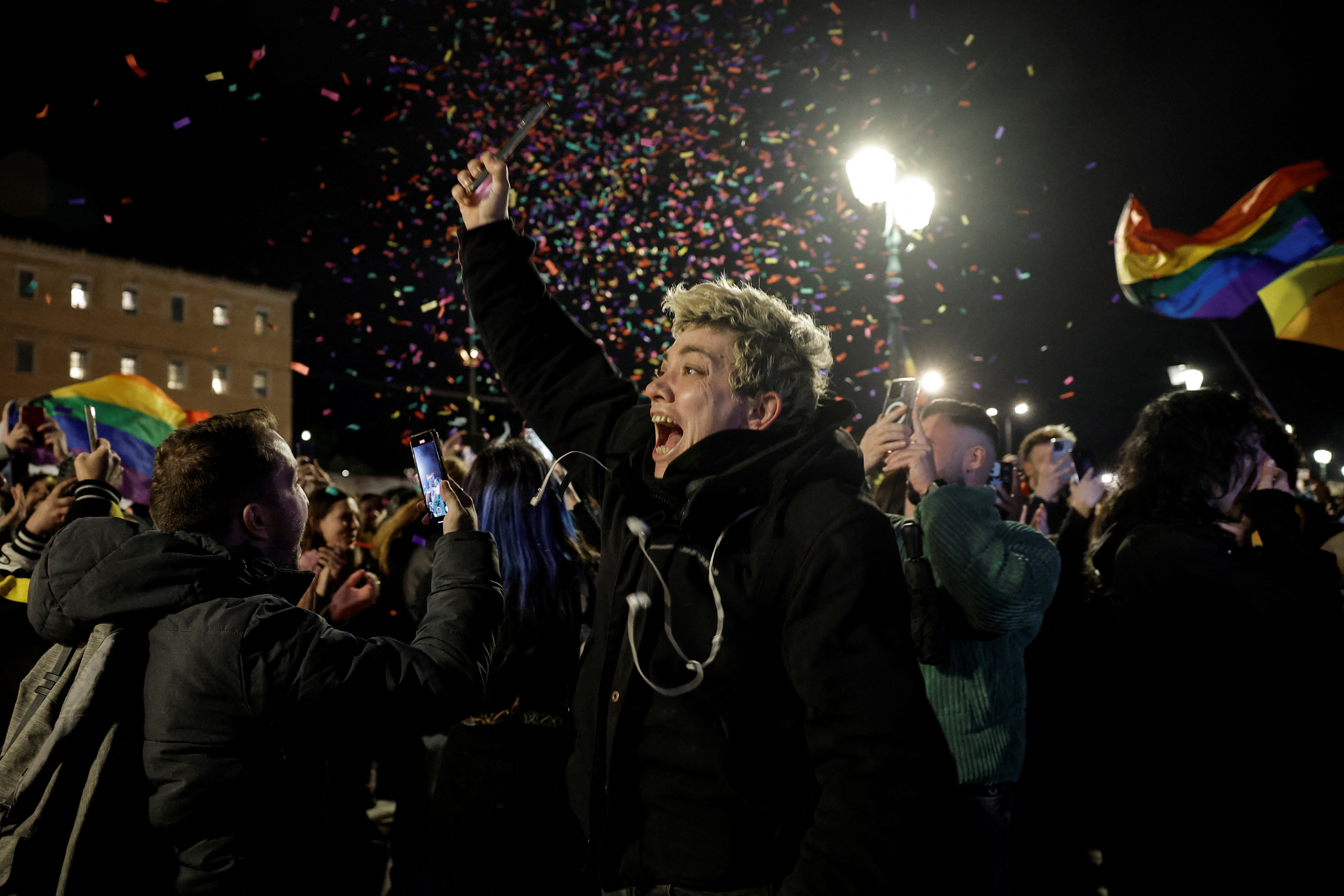 Members of the LGBTQ+ community and supporters celebrate in front of the Greek parliament, after the vote in favour of a bill which approved allowing same-sex civil marriages, in Athens, Greece, February 15, 2024. 