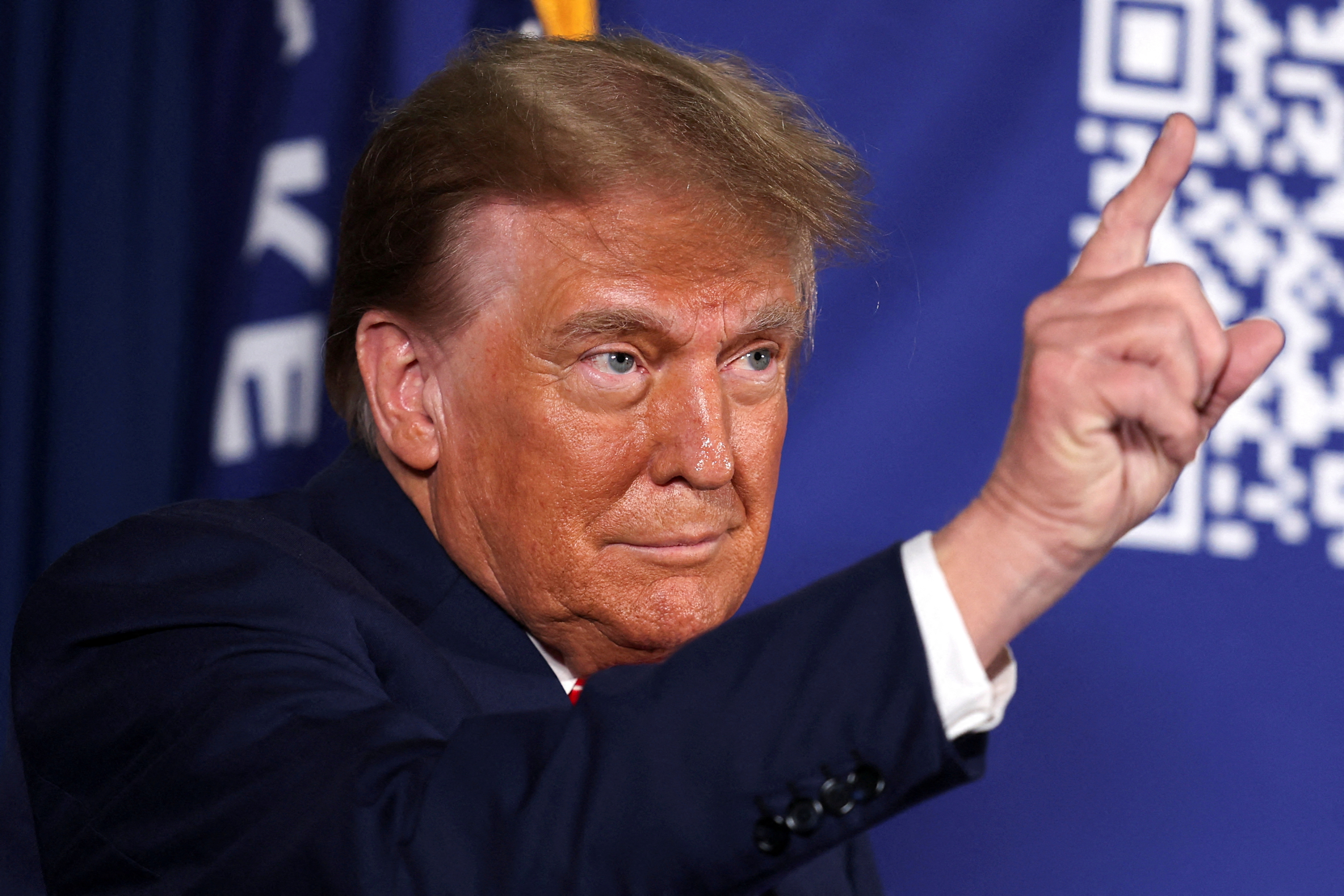 Former U.S. President and Republican presidential candidate Donald Trump gestures as he attends a rally in advance of the New Hampshire primary election in Laconia, New Hampshire, U.S. January 22, 2024. 