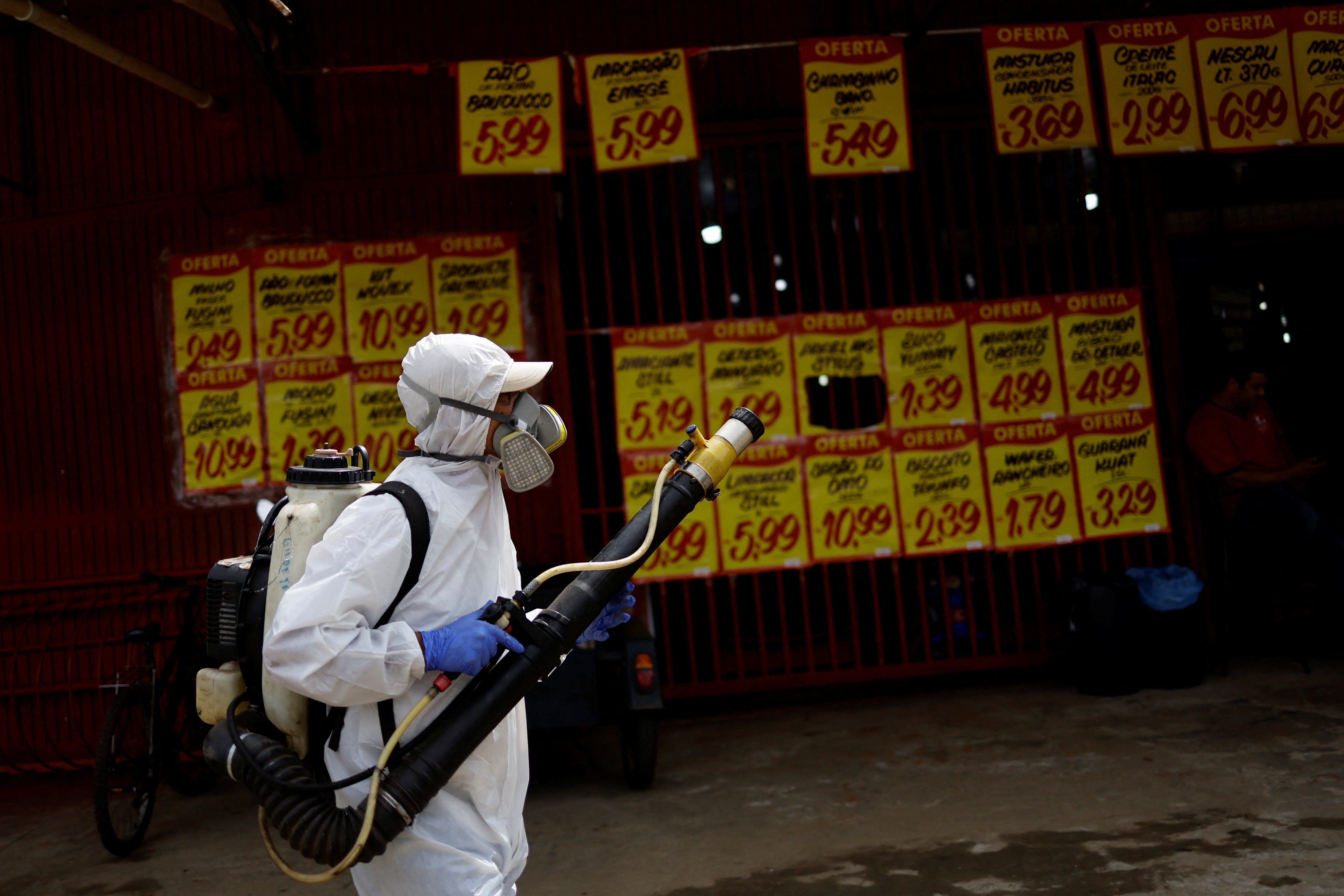 A health worker prepares to spray insecticide to kill the Aedes aegypti mosquito to help mitigate a dengue outbreak in the Ceilandia neighborhood of Brasilia, Brazil February 7, 2024. 