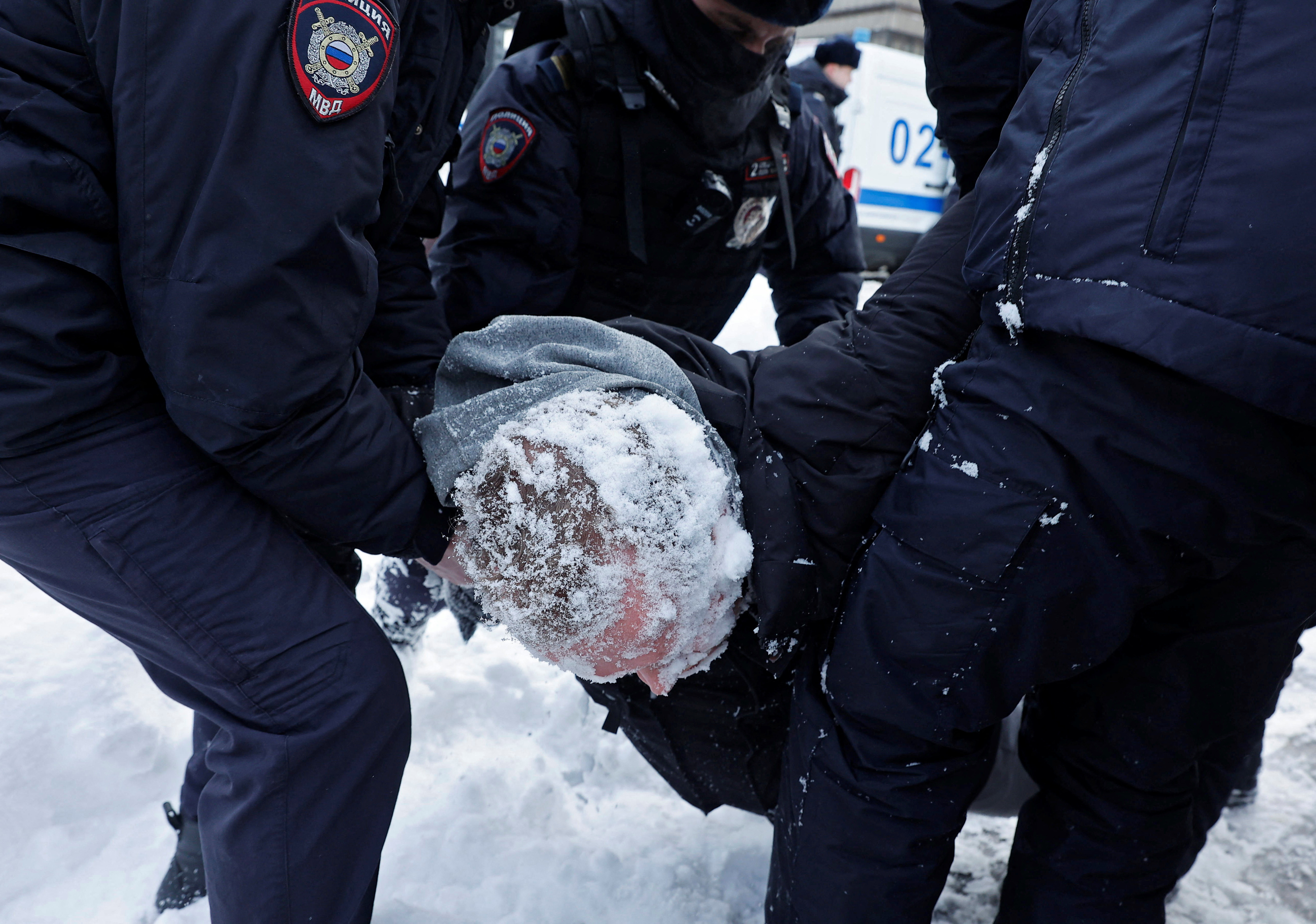 Police officers detain a man during a gathering in memory of Russian opposition leader Alexei Navalny near the Wall of Grief monument to the victims of political repressions in Moscow, Russia February 17, 2024. 