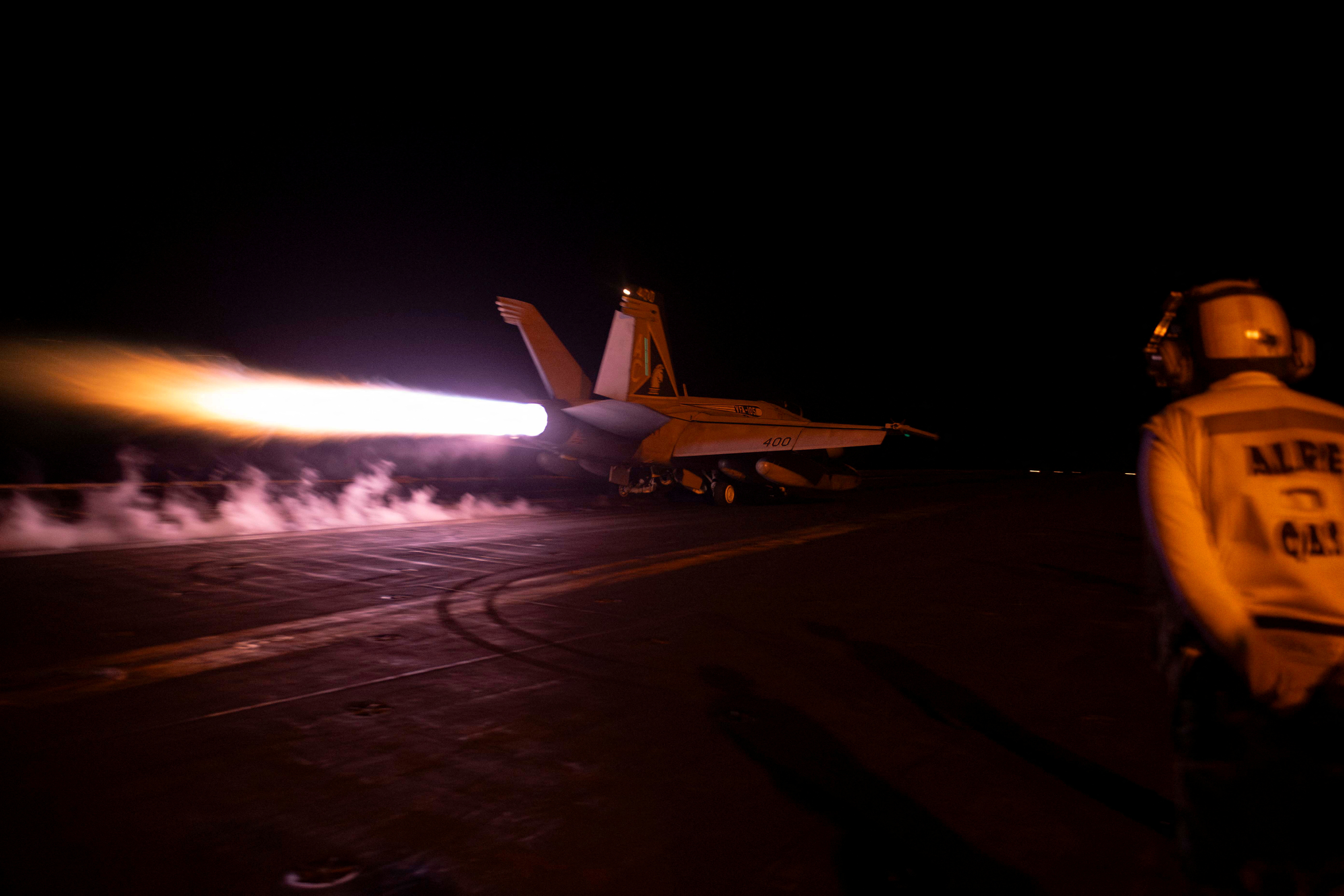 A fighter jet is launched from the U.S. Navy aircraft carrier USS Dwight D. Eisenhower during a strike against what the U.S. military describe as Houthi military targets in Yemen, February 3, 2024. 