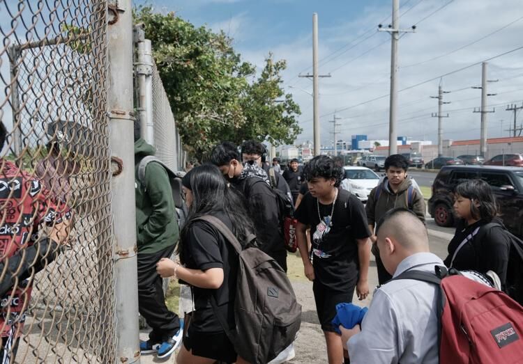 Students enter the John F. Kennedy High School campus in Tamuning on Wednesday, Jan. 17, 2024. 