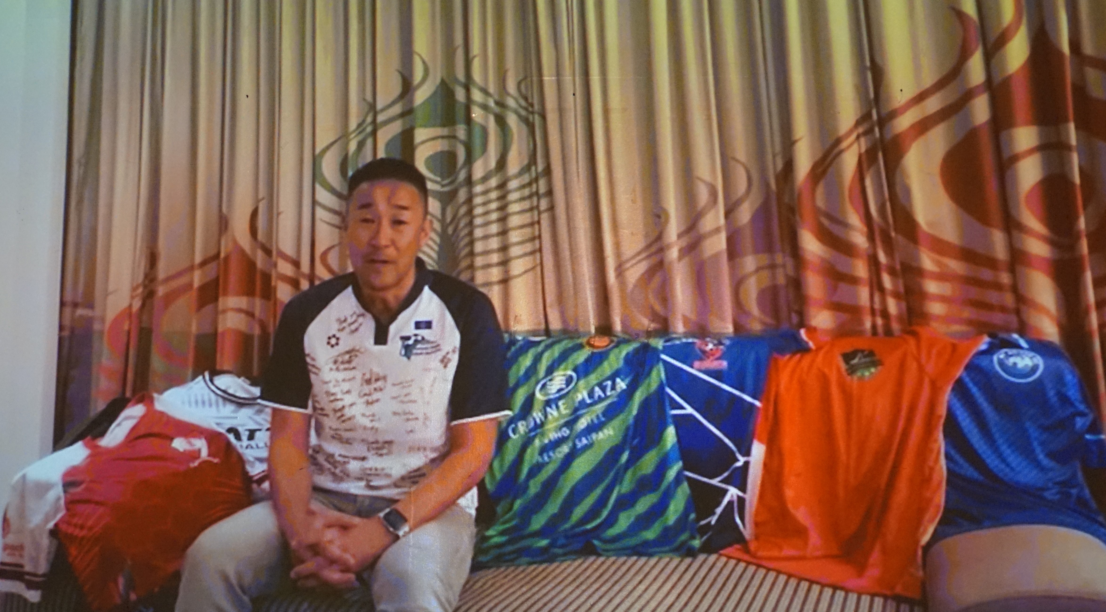 Coach of the Year Mitchiteru Mita delivers his remarks in a video recording that was shown during the 2023 Northern Marianas Sports Association Annual Awards Banquet at the Hibiscus Hall of Crowne Plaza Resort Saipan on Wednesday.