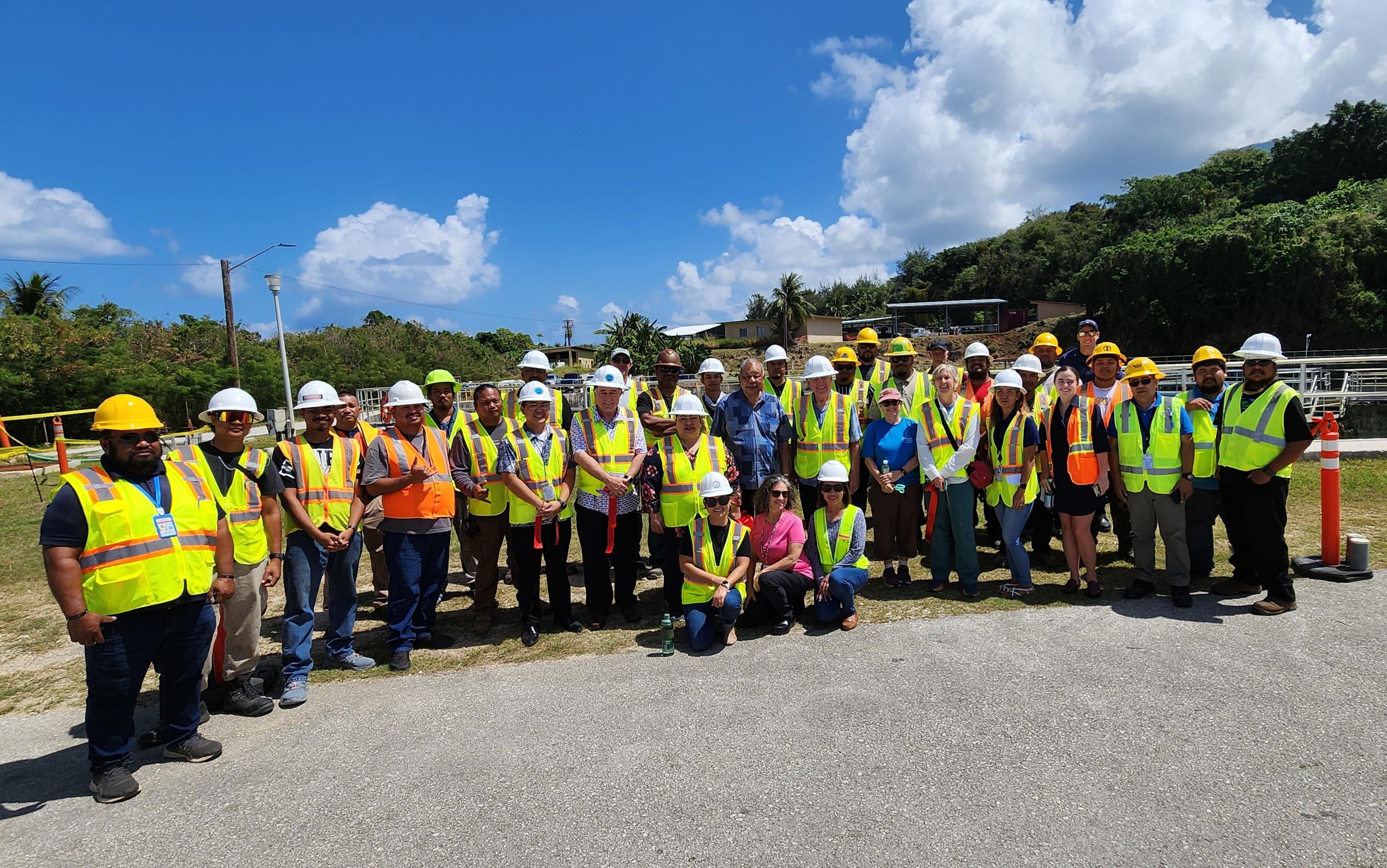 Sadog Tasi Wastewater Treatment Plan operators pose for a photo with Federal Judge David O. Carter, acting Gov. David M. Apatang and officials of the Commonwealth Utilities Corp., U.S. Department of Justice and the Environmental Protection Agency.