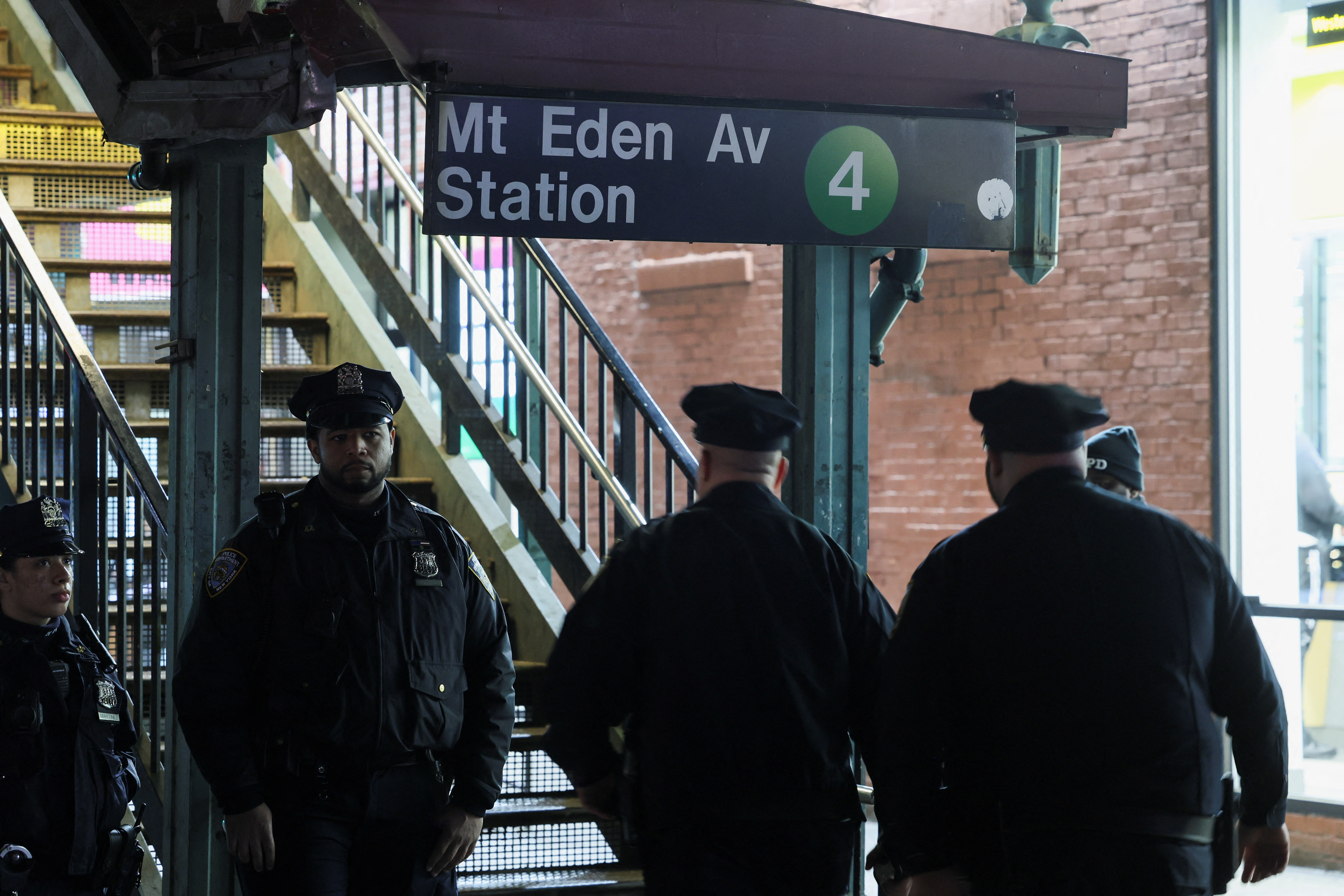 Members of the New York Police Department (NYPD) investigate the scene of a shooting at the Mount Eden Avenue subway station in the Bronx borough of New York City, U.S. February 12, 2024. 