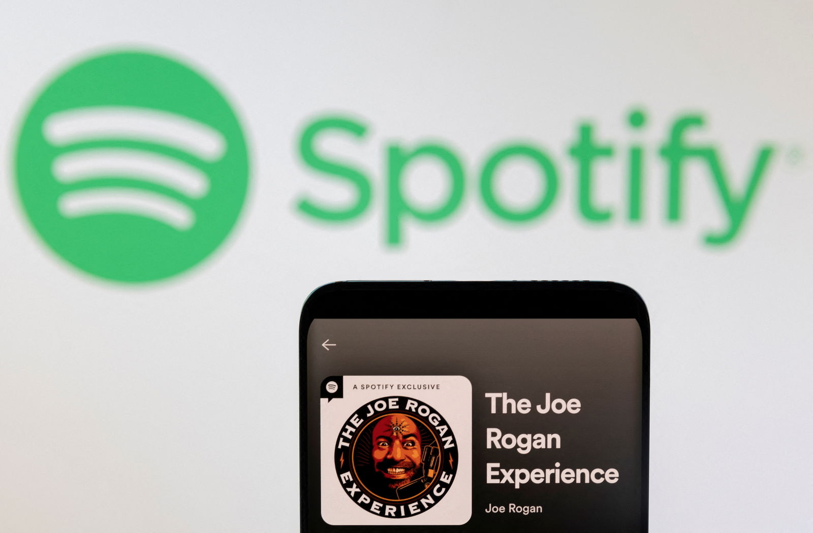 Joe Rogan's Spotify profile is seen in front of displayed Spotify logo in this photo illustration taken, February 7, 2022. 