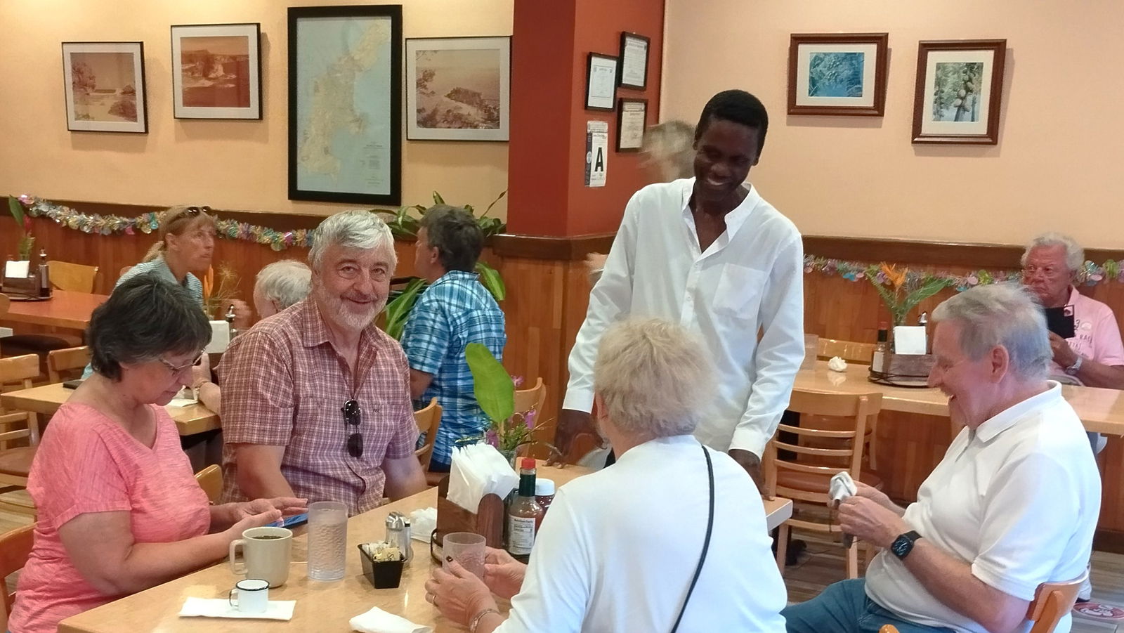 German guests experience Chicken Kelaguen wraps and local history at Herman's Modern Bakery.