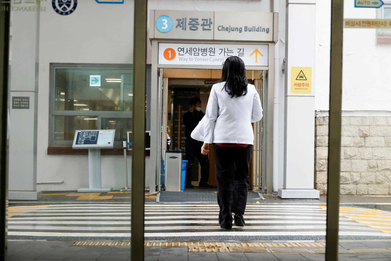 FILE PHOTO: A medical worker walks at Severance Hospital in Seoul, South Korea, February 21, 2024. 