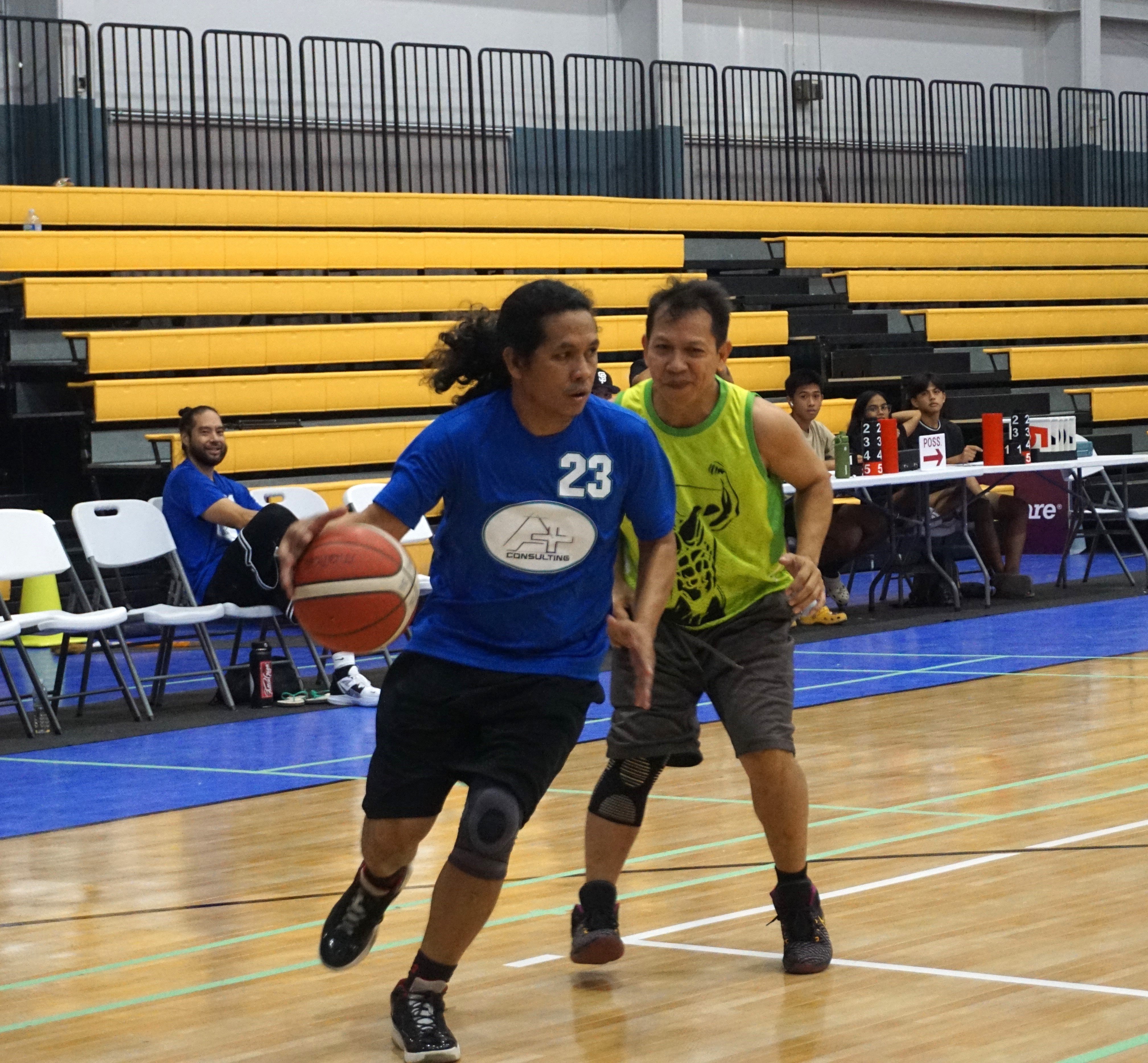 A Plus' Jun Estolas looks on as he drives past a defender during a Masters "Internal" Basketball League game at the Ada gym on Saturday.
