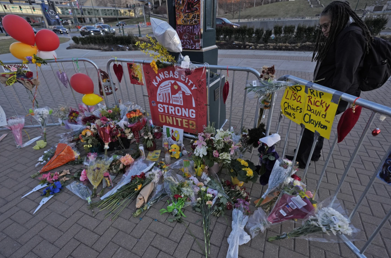 A person views a memorial dedicated to the victims of last week’s mass shooting in front of Union Station, Sunday, Feb. 18, 2024 in Kansas City.