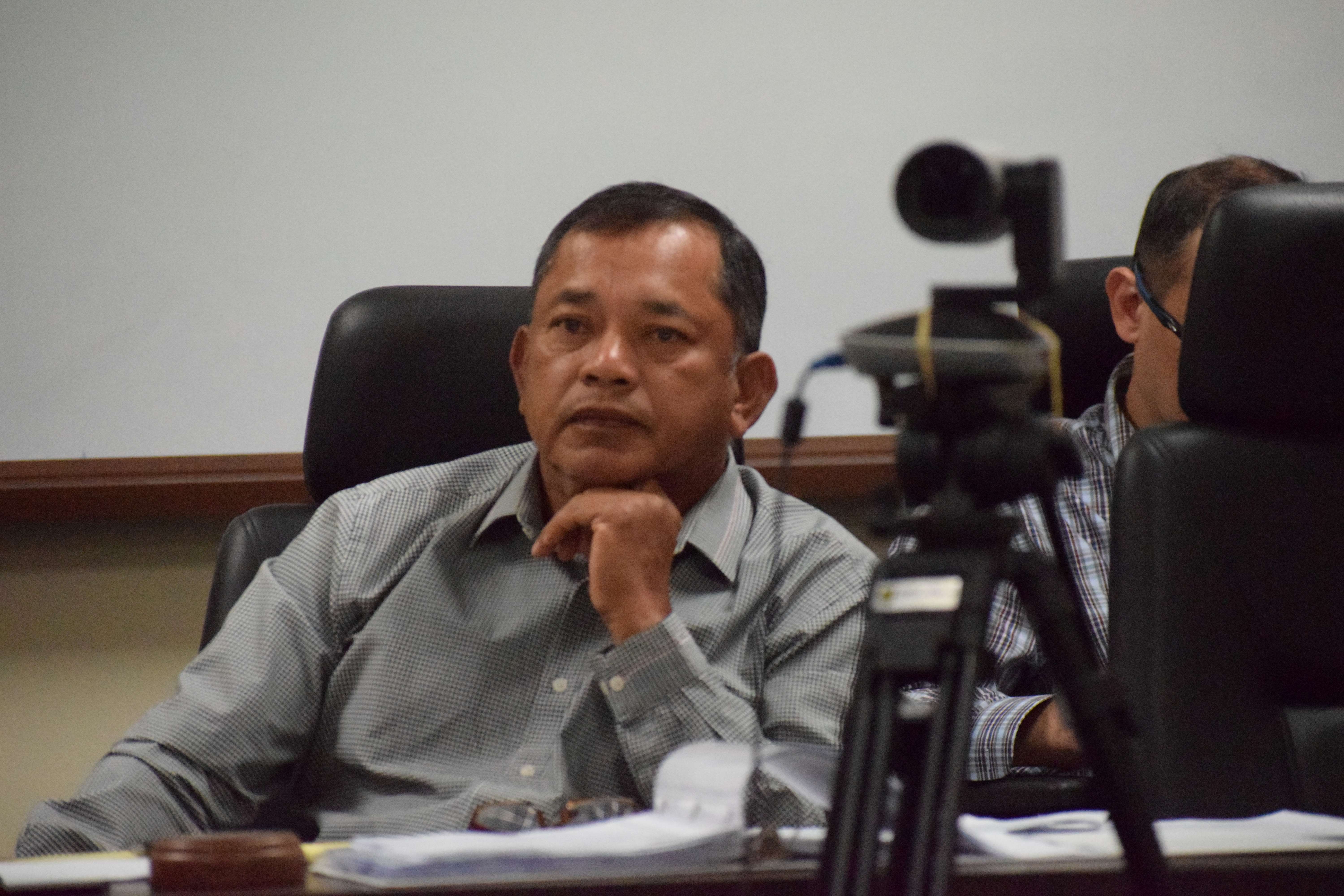 Commonwealth Casino Commission Vice Chair Ralph S. Demapan listens during a revocation hearing on Imperial Pacific International's exclusive casino license in the commission's conference room in Gualo Rai on Wednesday.