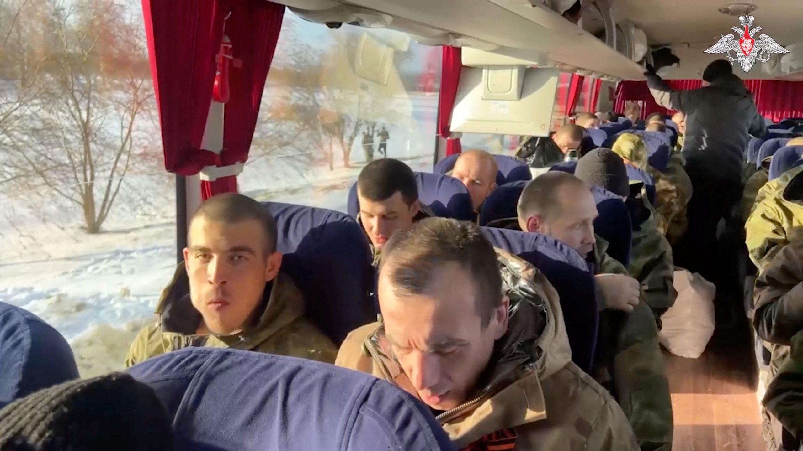 A still image from video, released by the Russian Defense Ministry, shows what it said to be captured Russian service personnel in a bus following the latest exchange of prisoners of war at an unknown location in the course of Russia-Ukraine conflict, in this image taken from handout footage released January 31, 2024.