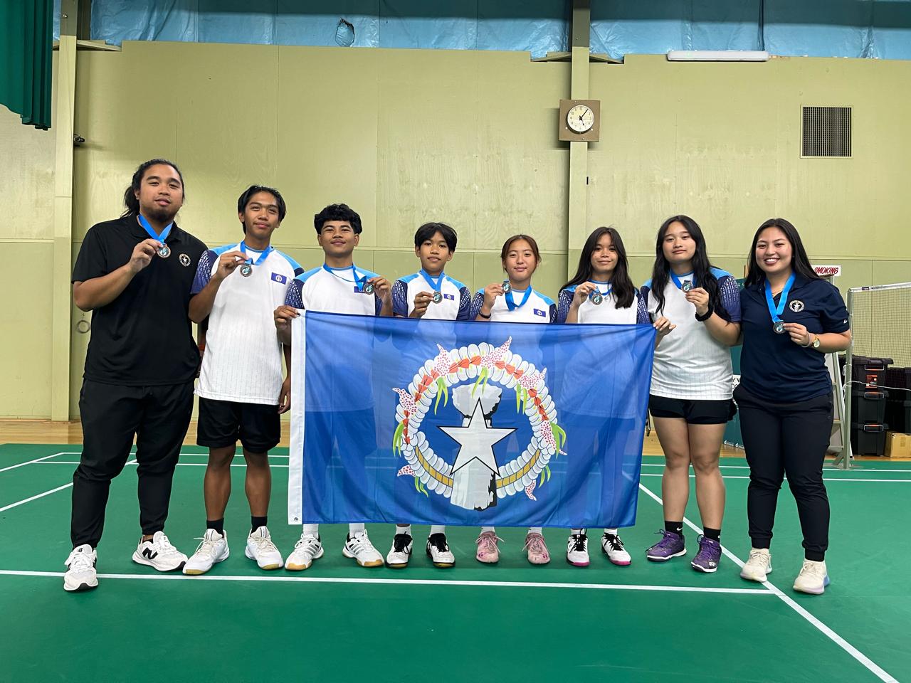 The NMI Junior National Badminton Team members and their coaches pose with their third-place medals during the awards ceremony of the Pacific Under 17 Invitation Team Challenge 2024 in Victoria, Australia, Sunday.