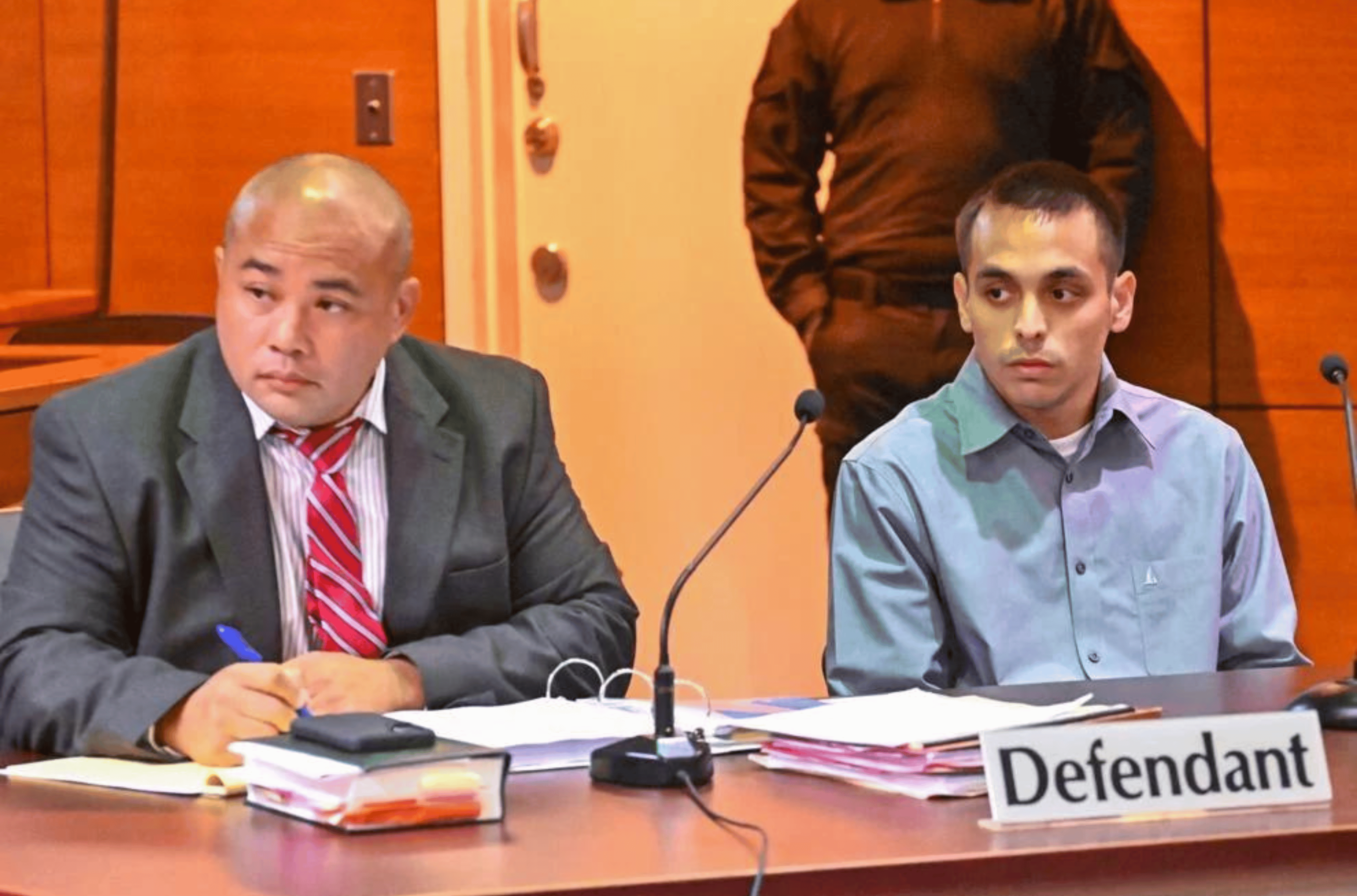  Defense attorney Peter Santos, left, sits with Jamie John Nededog on Wednesday, Feb. 7, 2024, during Nededog's trial at the Superior Court of Guam in Hagåtña. Nededog is accused in the murder of Edwin Pirando. 