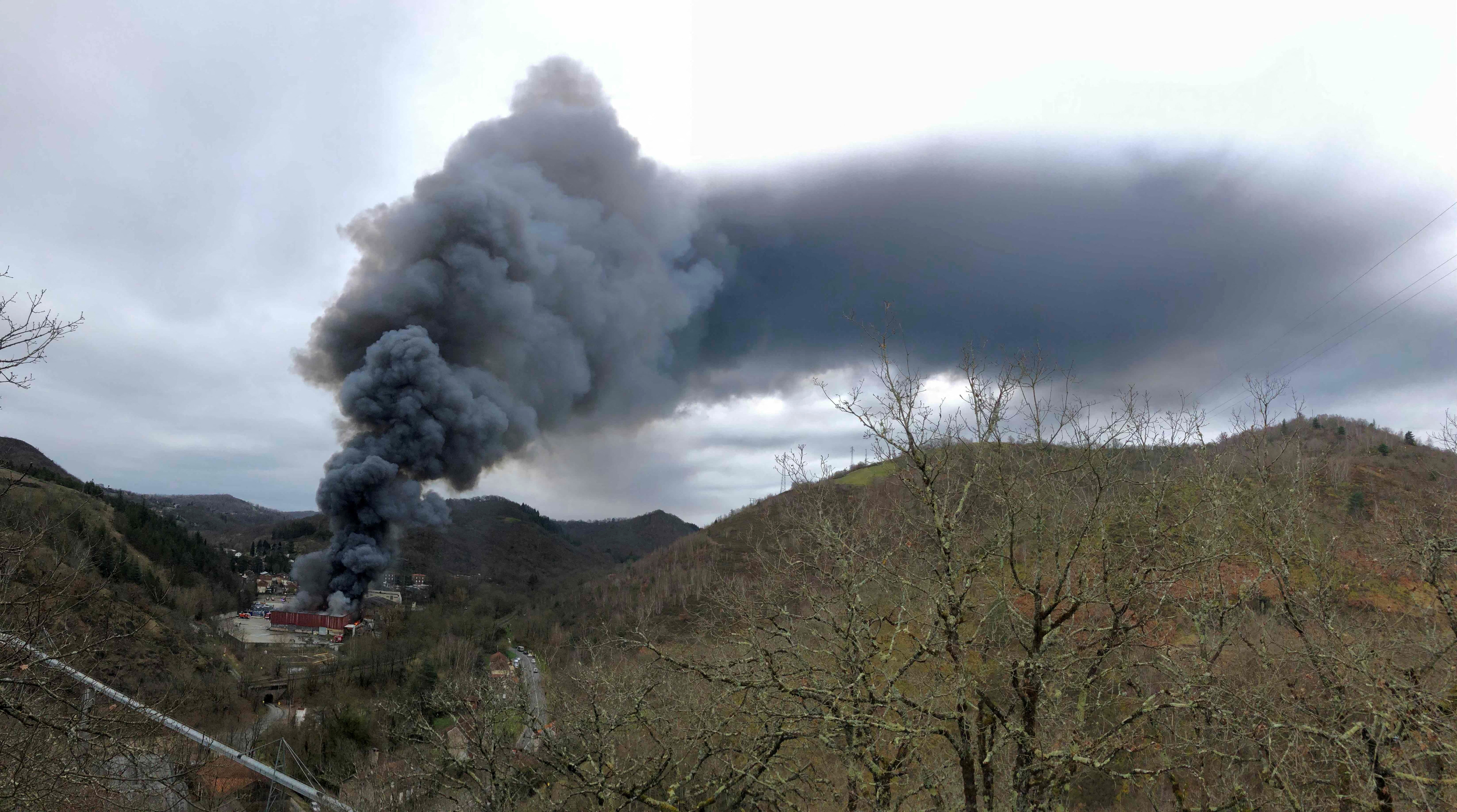 Smoke rises from a warehouse fire, owned by French recycling group SNAM, which houses lithium batteries in Viviez, north of Toulouse, France February 17, 2024 in this image obtained from social media. 
