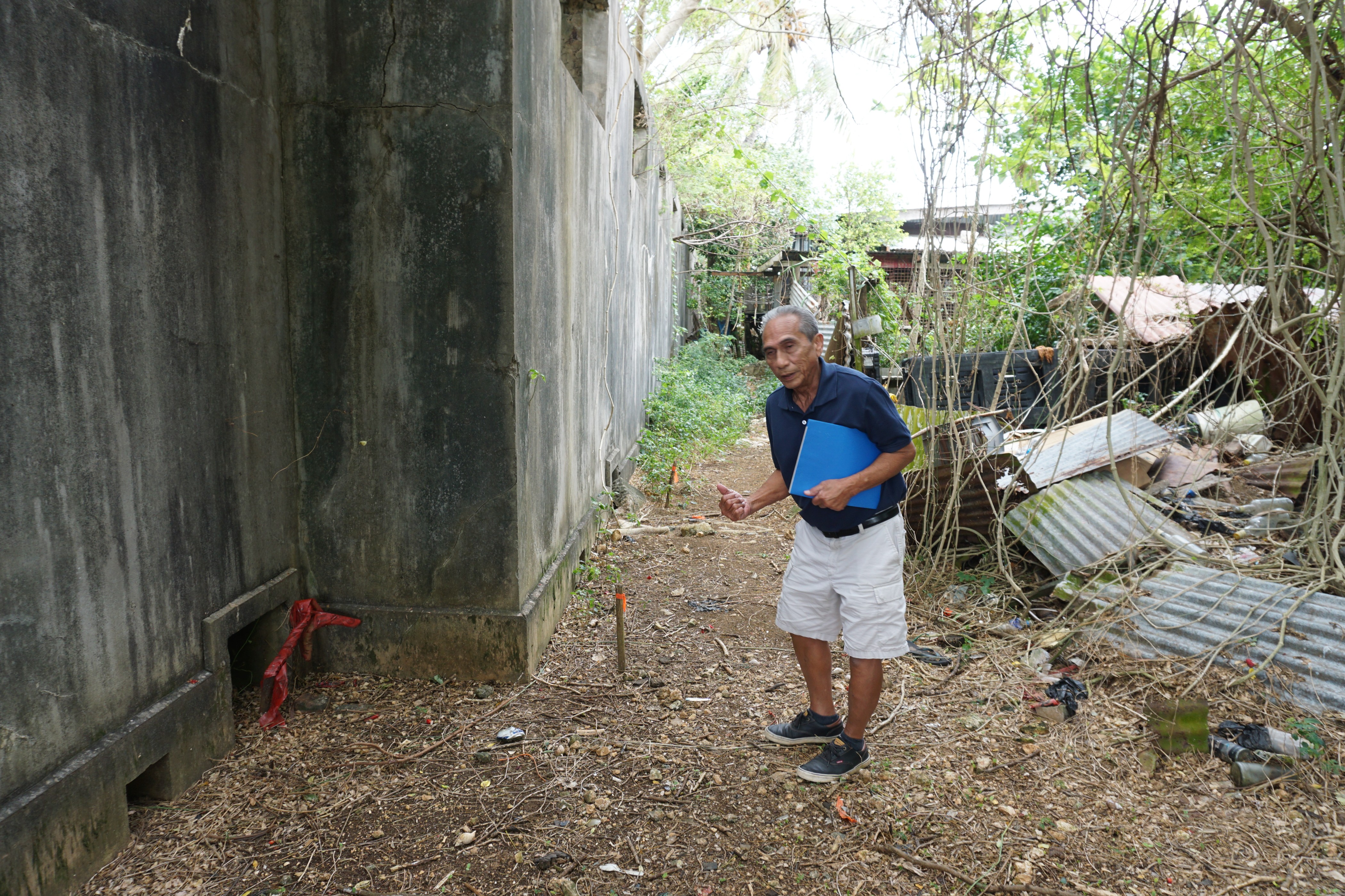 Last year, Ernesto C. Arriola rented ground penetrating radar equipment, which he used at the old Japanese jail in Garapan. Next to him is a stake that marks the location of what he believes to be one of the “anomalies” in the ground.