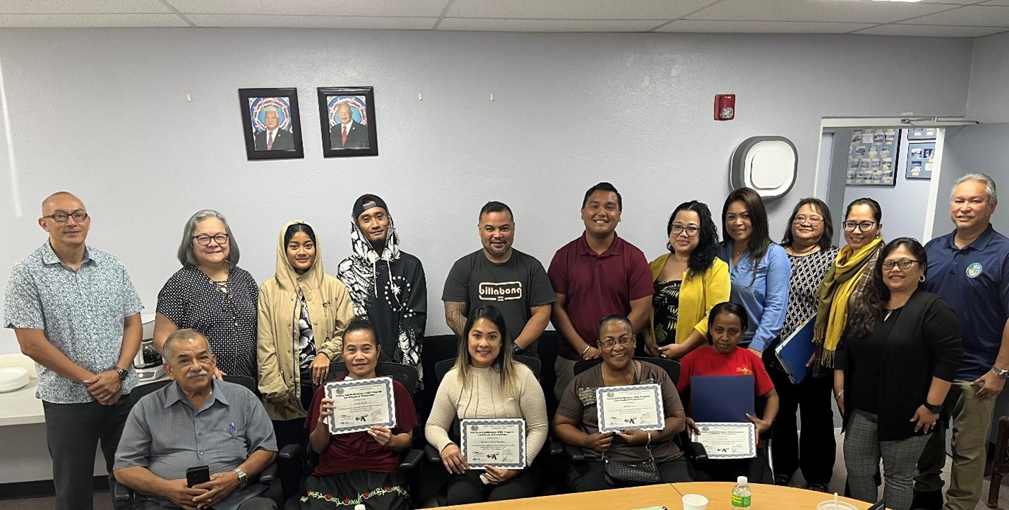 FSS graduates  Louisa L. Taga, Narcely Martin, Marline Anson, and  Rose Marie A. Borja with the NMHC Board of Directors,  corporate director, deputy corporate director and staff.