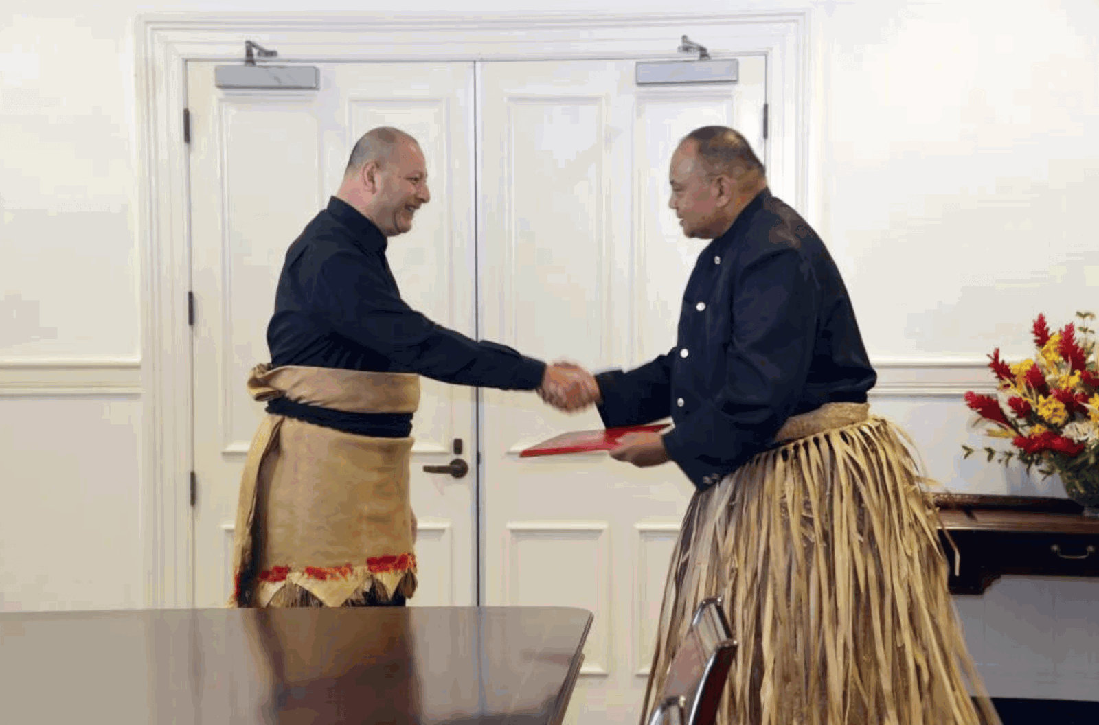 King Tupou VI receives Tonga's new Prime Minister Siaosi Sovaleni, after presenting the Royal Warrant of Appointment for the PM at the Royal Palace in Nuku'alofa on Tuesday 28 December 2021. Sovaleni was elected as PM by the new parliament, following Tonga's November 18 general election. 