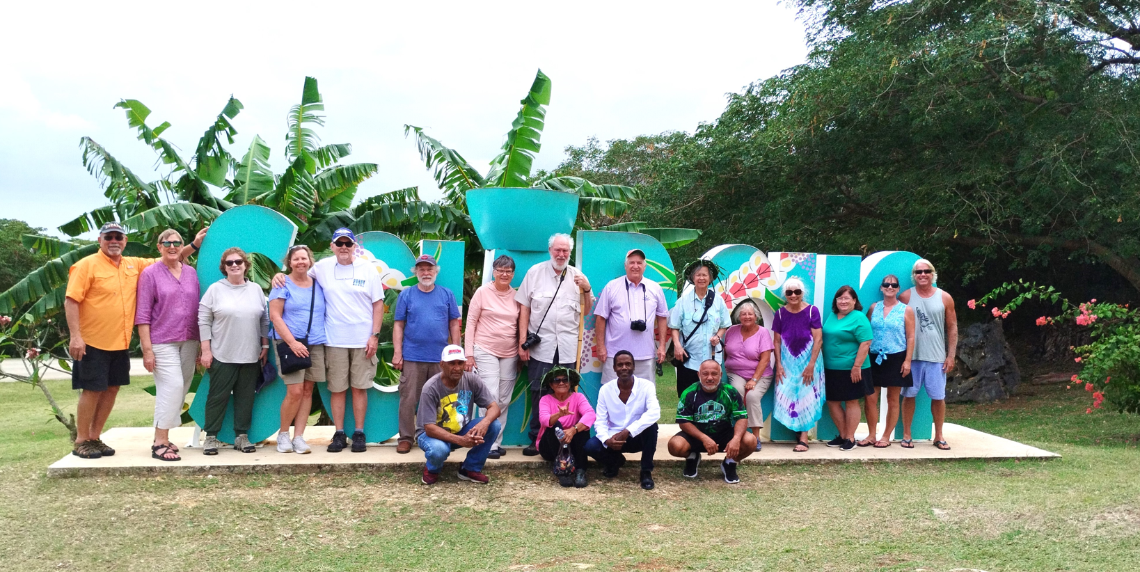 Local residents, front row, Willy Kaitabu, Josephine Rabauliman, Walt Goodridge and Alvin Takai share Saipan's beauty with guests from Holland America's MS Zuiderdam on shore for a day: Joel Z., Sharon Z., Amy E., Norma B., Tom B., Rick B., Linda T., David T., Jim C., Patricia S., Sherry G., Arlene S., Cathy C., Tina H. and Rick H.