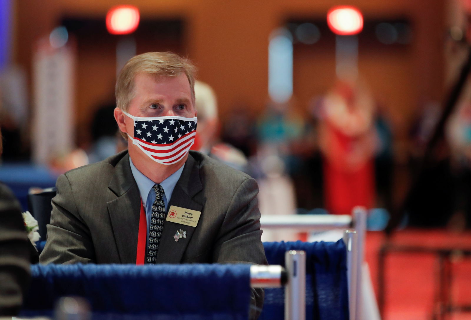 FILE PHOTO: Mississippi's national committeeman to the Republican National Committee Henry Barbour attends U.S. President Donald Trump's speech wearing a red, white and blue Amerian flag protective face mask because of the coronavirus disease (COVID-19) pandemic on the first day of the 2020 Republican National Convention in Charlotte, North Carolina, U.S., August 24, 2020. 