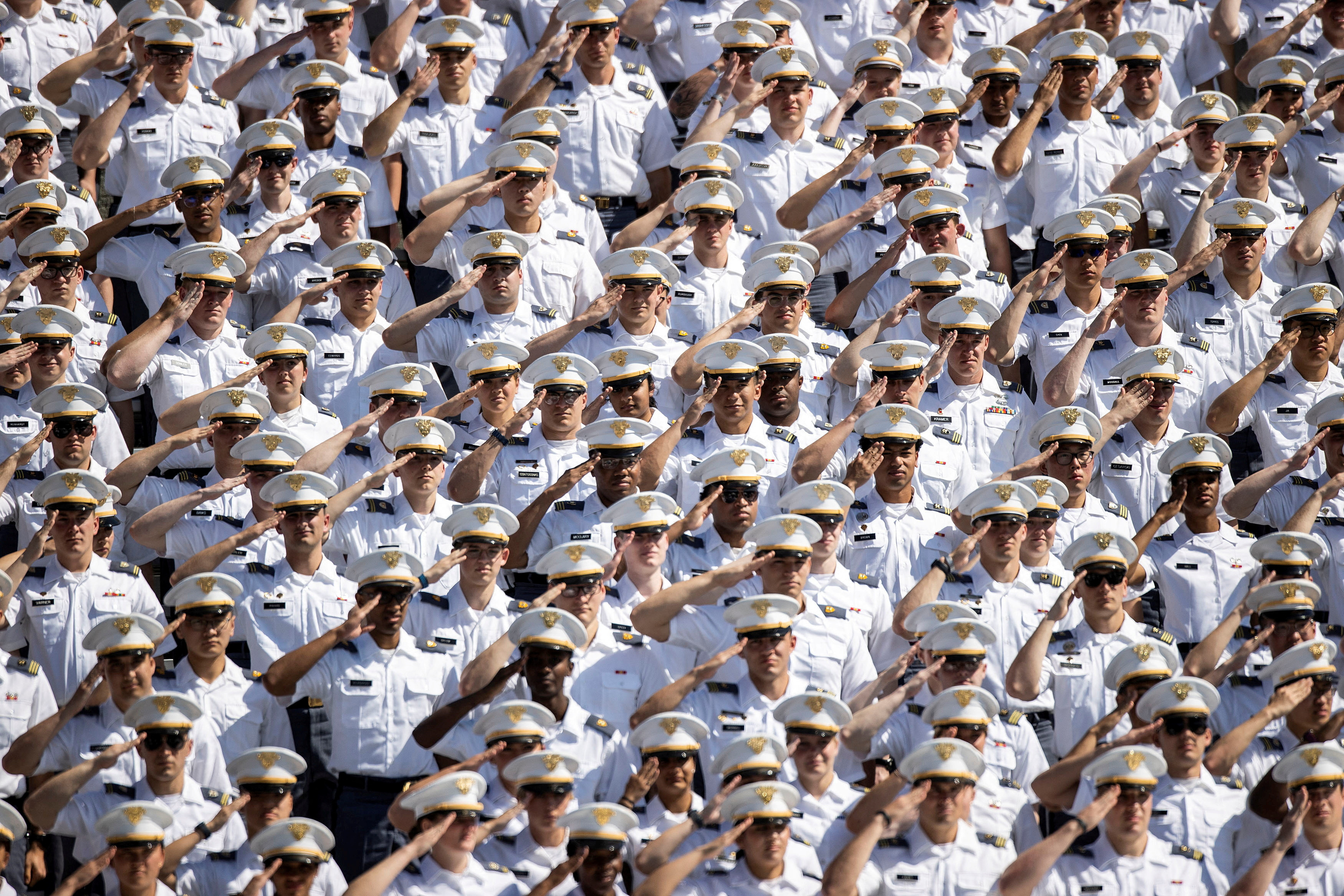Cadets salute while U.S. Vice President Kamala Harris arrives to attend the 2023 graduation ceremony at the United States Military Academy (USMA), at Michie Stadium in West Point, New York, U.S., May 27, 2023. 