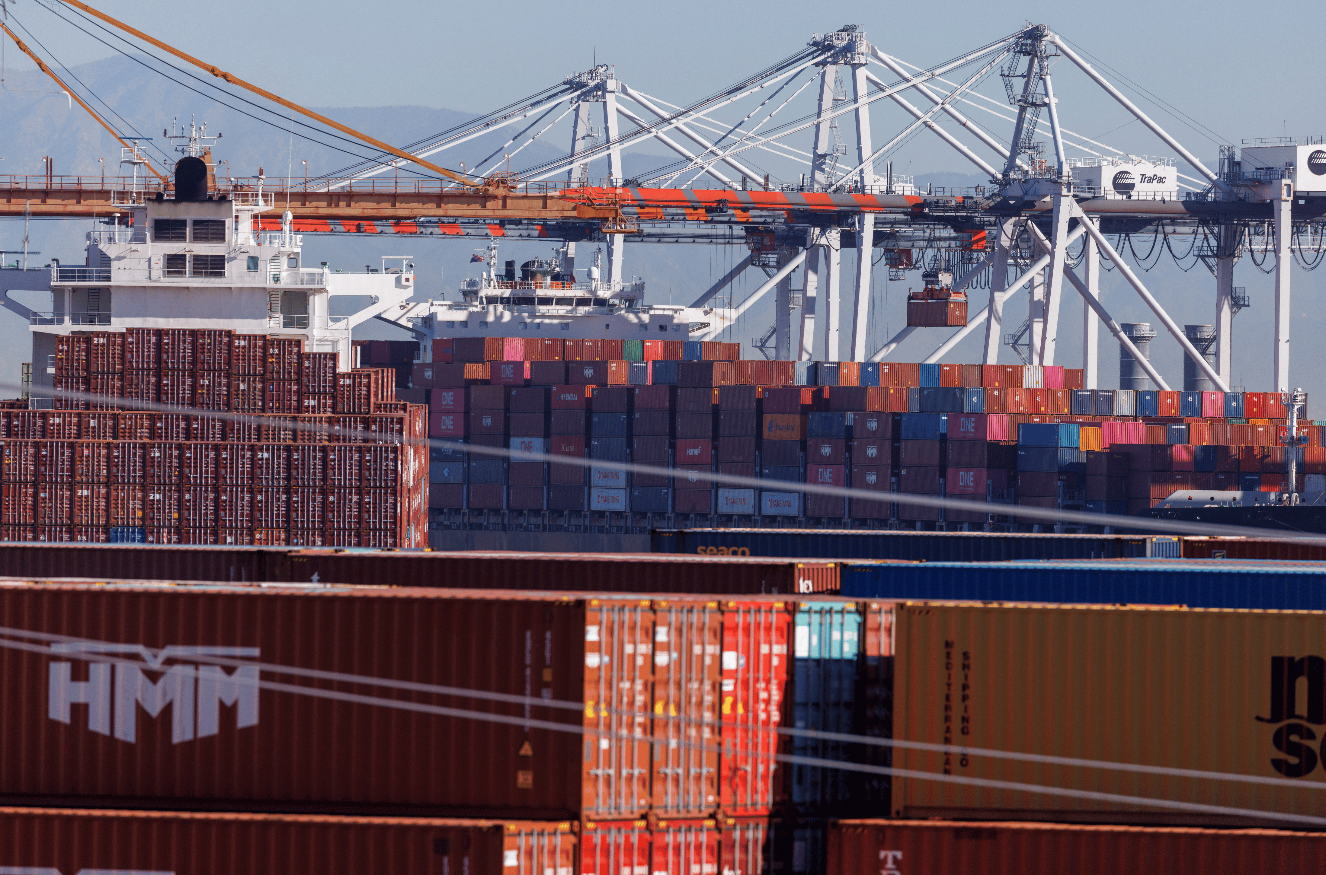 Stacked containers are shown as ships unload their cargo at the Port of Los Angeles in Los Angeles, California, U.S. November 22, 2021. 