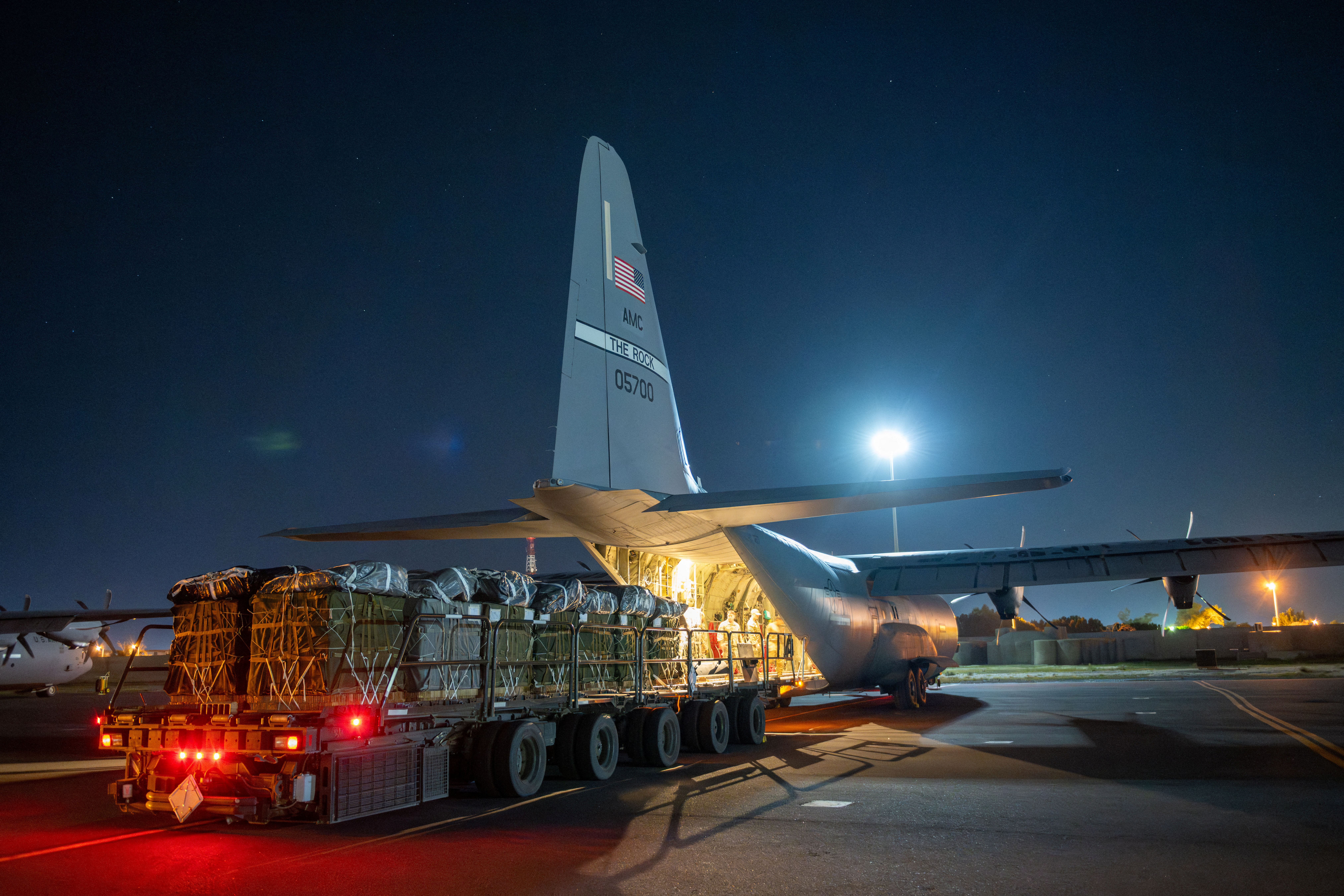 Over 38,000 Meals Ready to Eat and water destined for an airdrop over Gaza are loaded aboard a U.S. Air Force C-130J Super Hercules at an undisclosed location in Southwest Asia, March 1, 2024. 