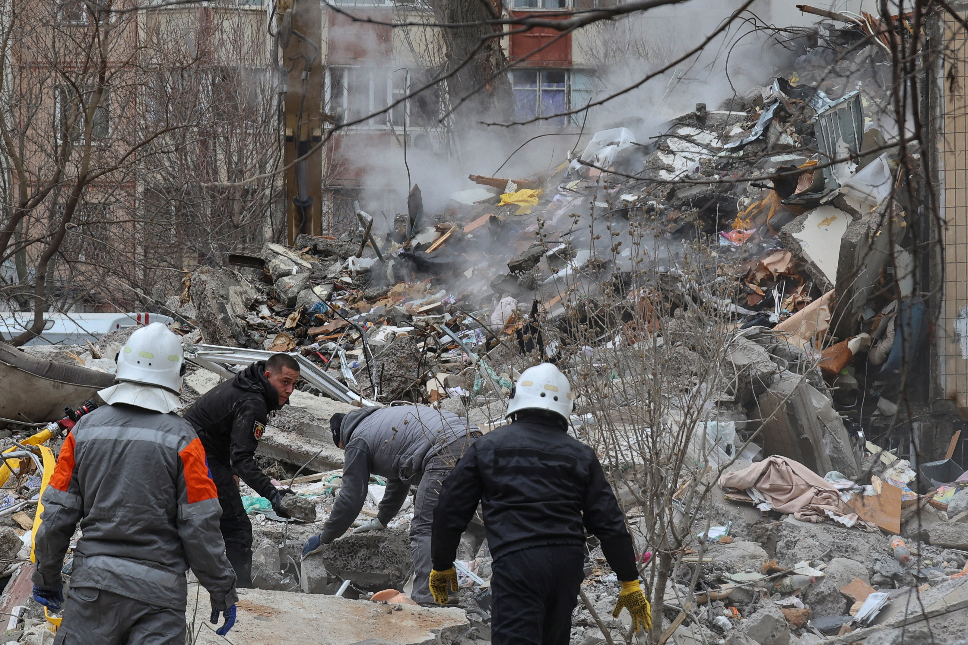 Rescuers work at the site of an apartment building heavily damaged by a Russian drone strike, amid Russia's attack on Ukraine, in Odesa, Ukraine March 2, 2024. 
