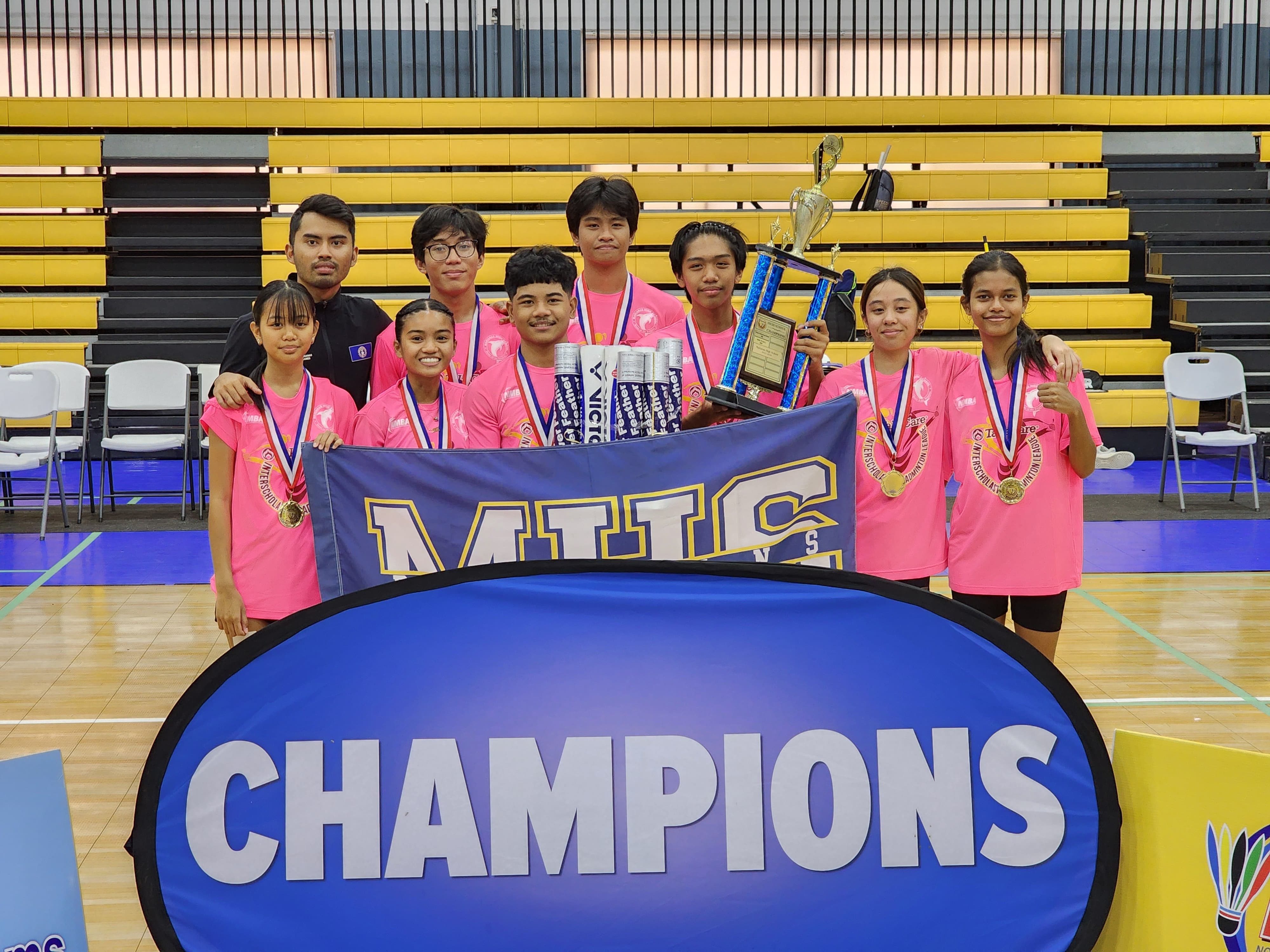 The Marianas High School team members pose for a photo with the championship trophy during the award ceremony of the NMBA-PSS Interscholastic Badminton League SY23-24 at the Ada gym on Saturday.
