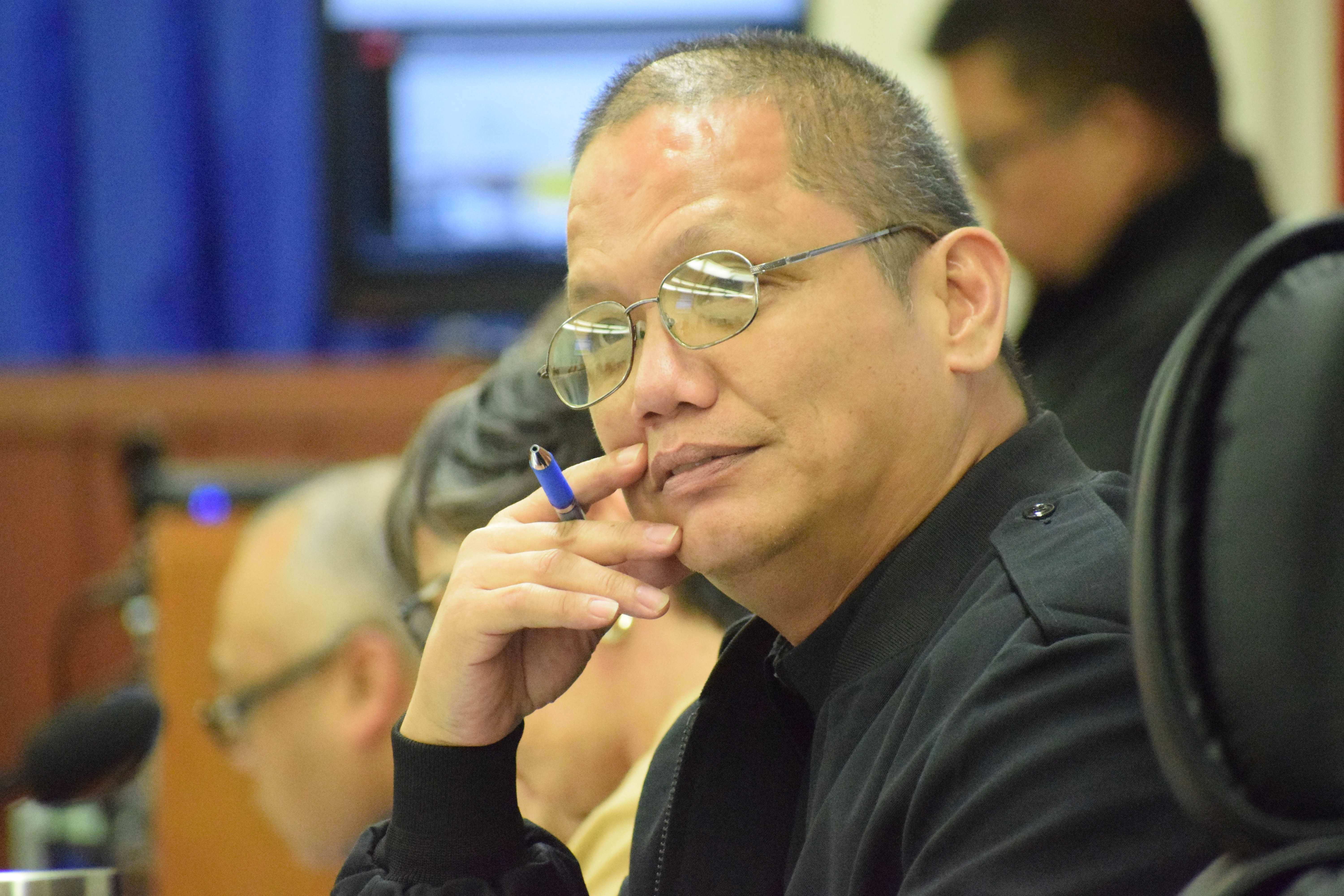 Rep. Vincent Aldan asks former Finance Secretary David DLG Atalig — not in photo —  a question.