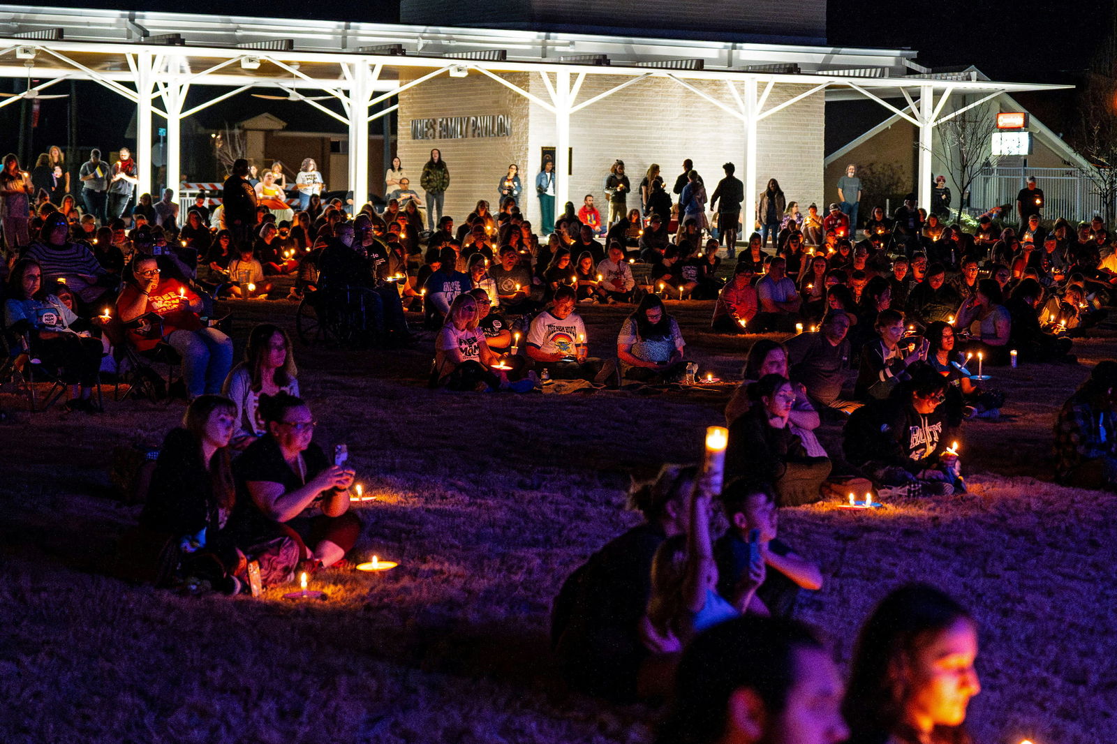 People attend a vigil in memory of nonbinary teenage student Nex Benedict, who died a day after an altercation in a girls high school bathroom in Owasso, Oklahoma, U.S. February 25, 2024. 