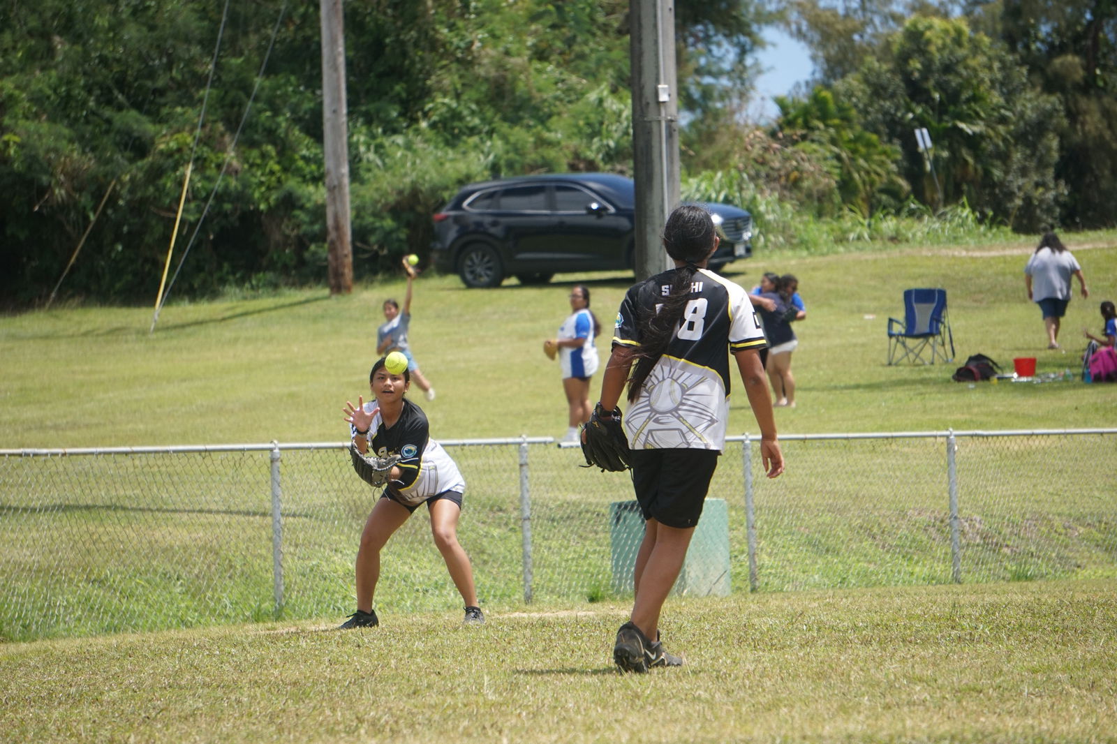 Tanapag Middle School pitcher Kayshlie Aguon throws Chelsea Santos on third base for an out during the championship game against Hopwood Middle School in the girls middle school division of the SBL-PSS Interscholastic Softball League SY23-24 at the Capital Hill baseball field on Saturday. 