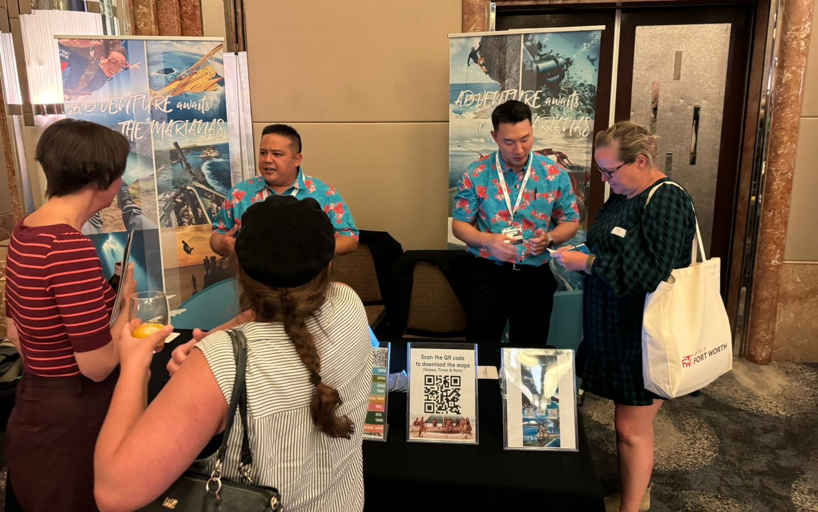 Marianas Visitors Authority Marketing Manager Thomas Kim, second right, and Tour Guide Certification Manager George Sablan, center, engage with travel agents and other travel  industry representatives at  the  Brand  USA  Australia  Road  Show on Feb. 19, 2024, in Melbourne, Australia.