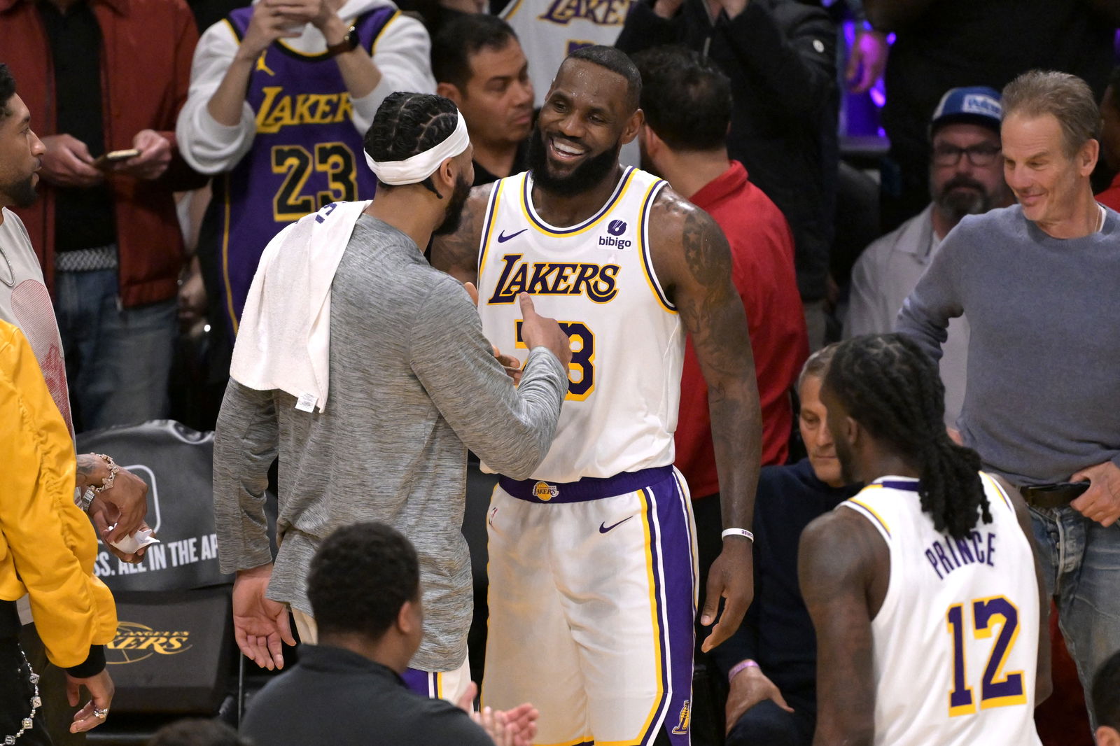 Mar 2, 2024; Los Angeles, California, USA; Los Angeles Lakers forward LeBron James (23) is congratulated by forward Anthony Davis (3) after scoring his 40,000th career point against the Denver Nuggets at Crypto.com Arena. 