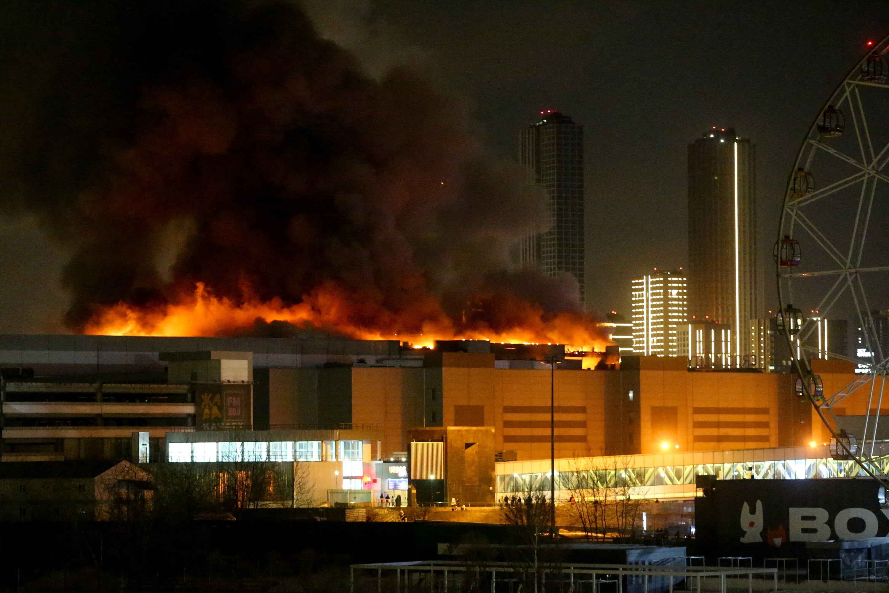 Smoke rises above the burning Crocus City Hall concert venue following a reported shooting incident, outside Moscow, Russia, March 22, 2024. 
