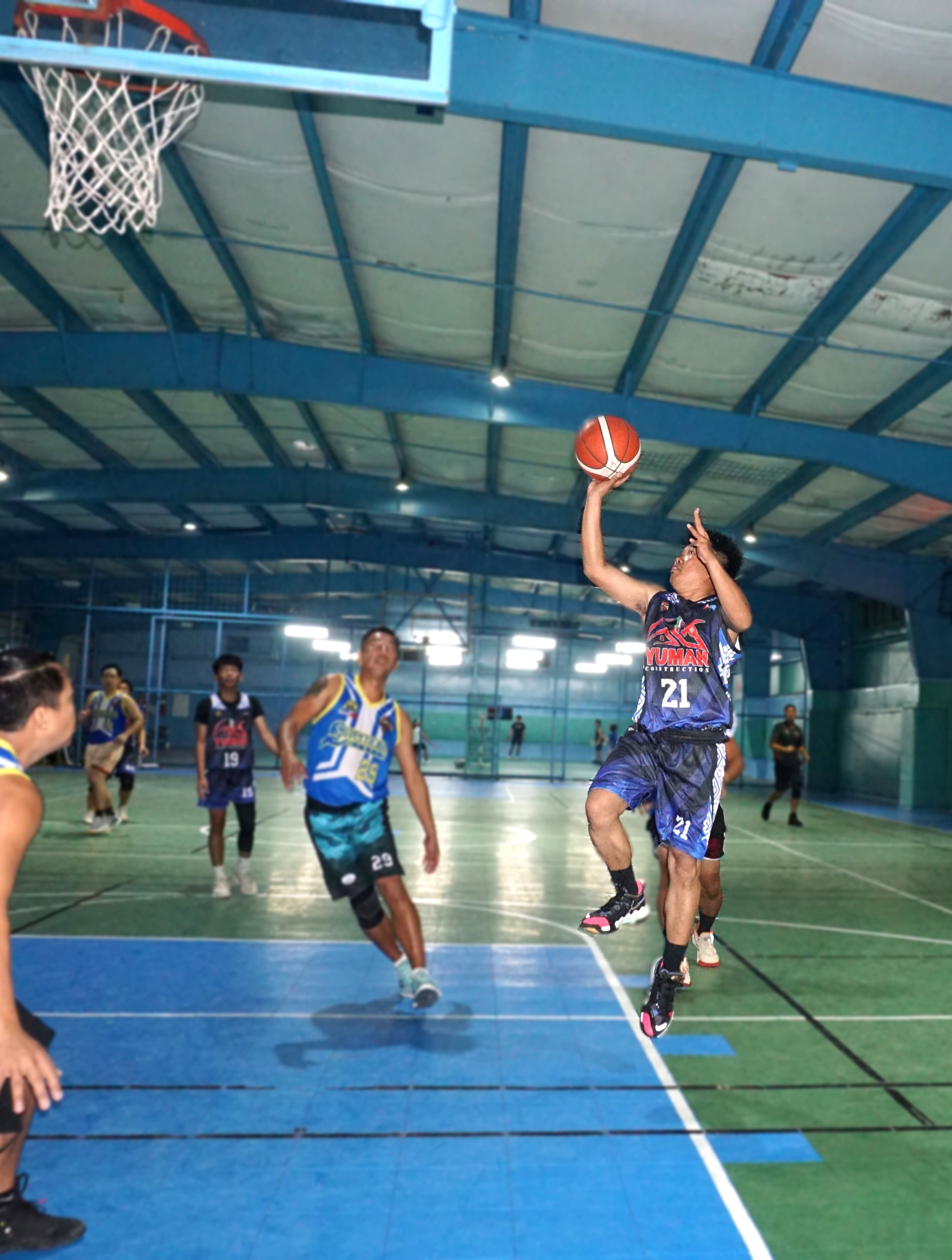 Yuman's Eric Nuyles attempts the running floater during a game against Savemore in season 2 of the Legends Sports Association Invitational Basketball League at the TSL Sports Complex.
