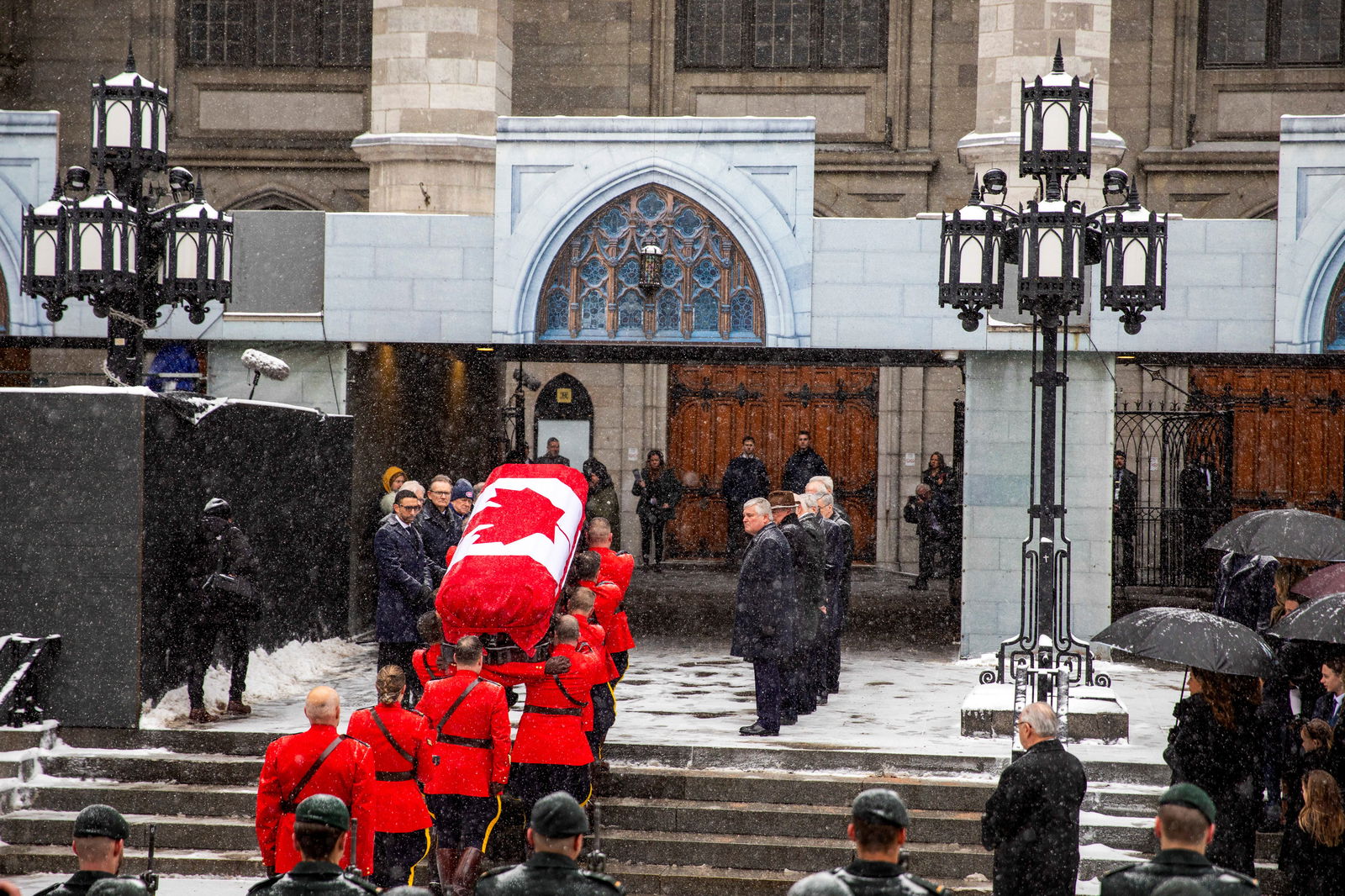 The casket of late former Canadian Prime Minister Brian Mulroney is carried by pallbearers to his state funeral at the Notre-Dame Basilica in Montreal, Quebec, Canada March 23, 2024. 