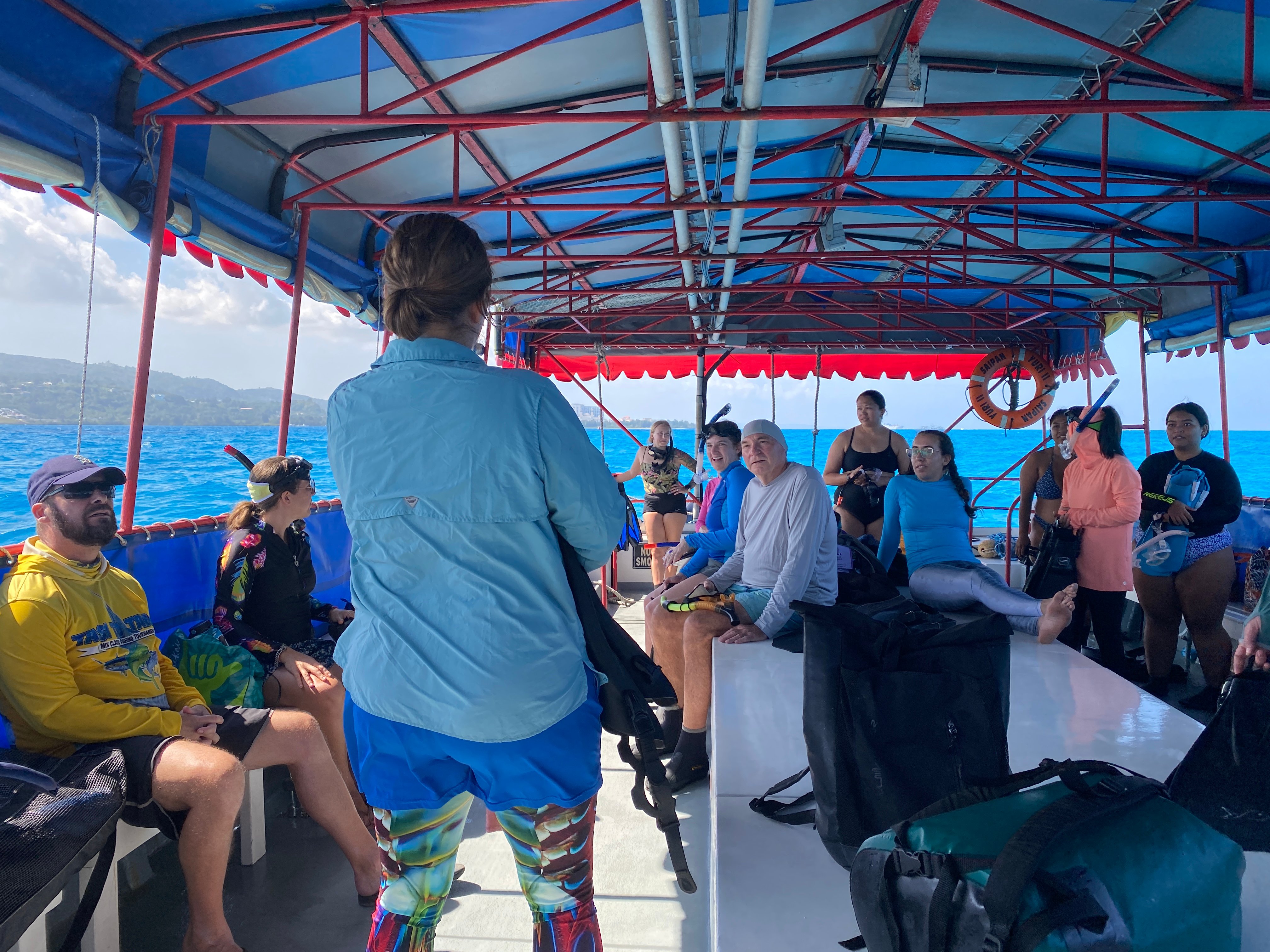 Mariana Islands Conservation Conference participants listen to Lyza Johnston ahead of their field trip to the Saipan Coral Nursery on Feb. 28.