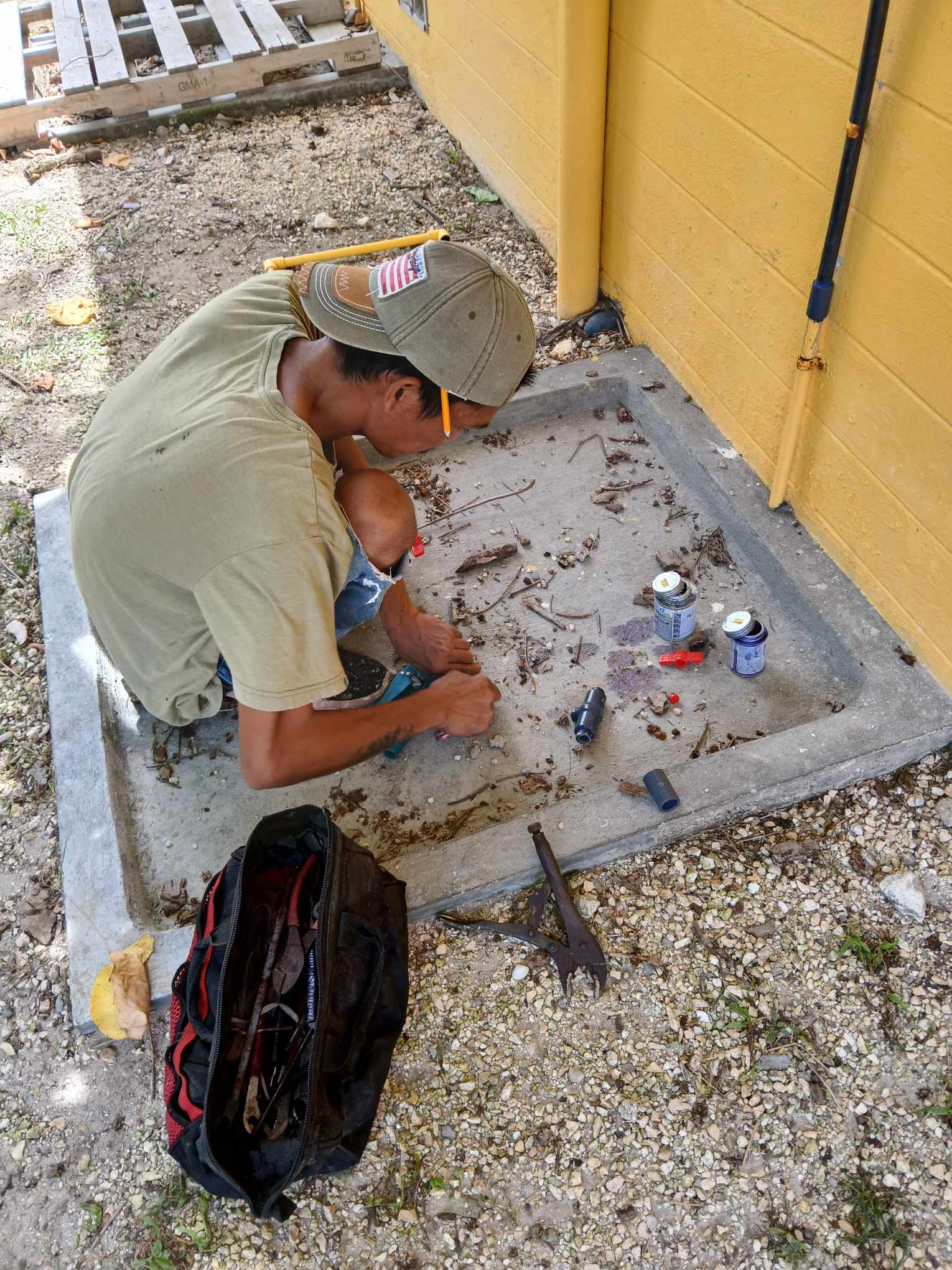 Max Aguon hired a worker to fix the broken water pipe of the public restroom at Laly 4 on Thursday afternoon.
