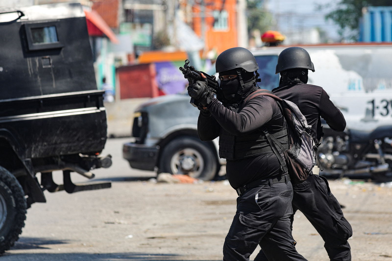 Police officers take part in an operation on the surroundings of the National Penitentiary following a fire, as a powerful gang leader in Haiti has issued a threatening message aimed at political leaders who would take part in a still-unformed transition council for the country, in Port-au-Prince, Haiti, March 14, 2024. 
