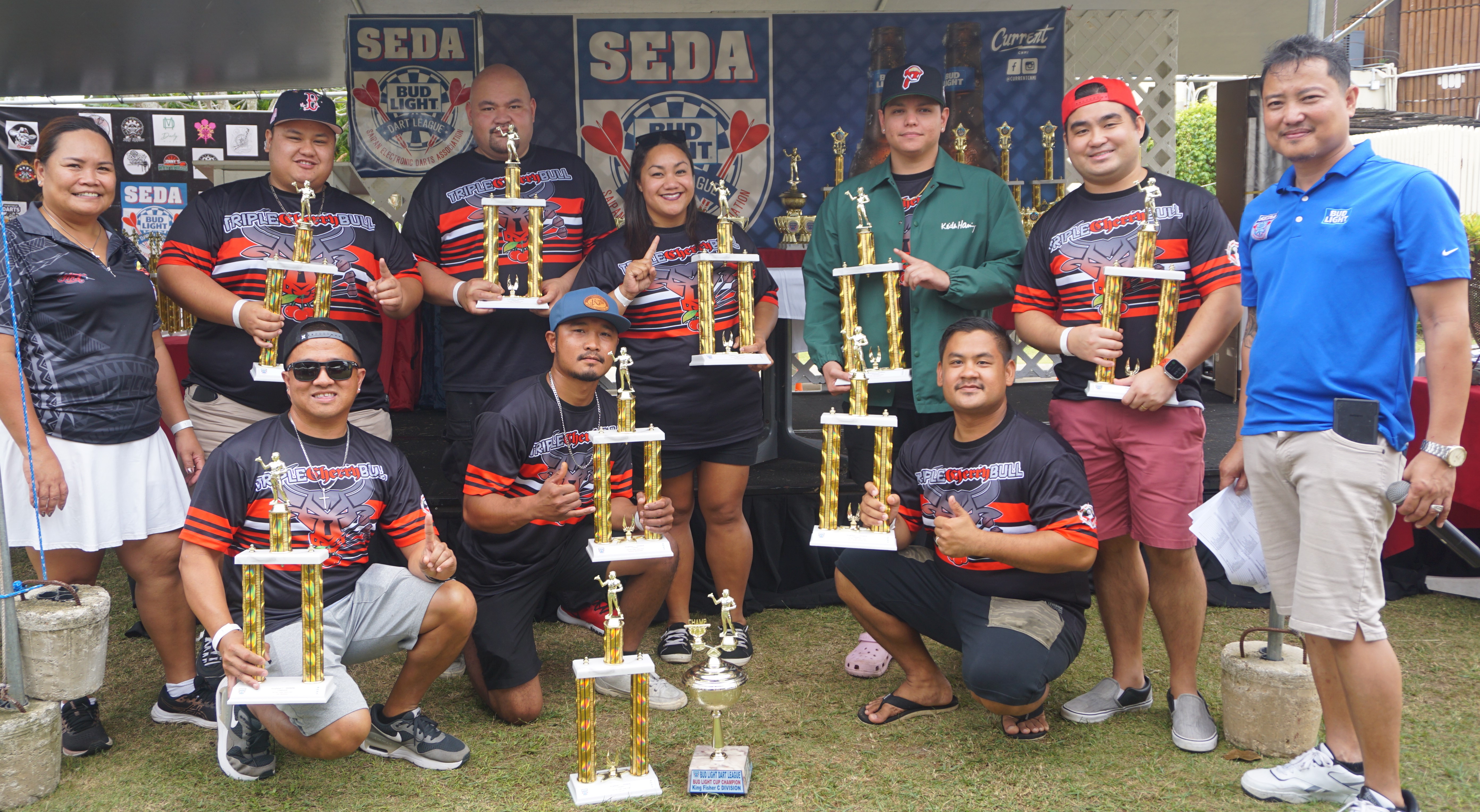 The Hut Triple Cherry Bull team members display their 1st place trophies and the Bud Light Cup in the Kingfisher C Division.