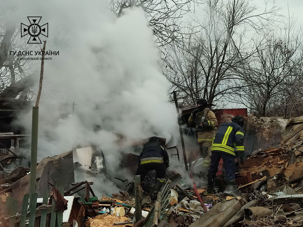 Firefighters work at the site where houses were damaged by a Russian drone strike, amid Russia's attack on Ukraine, in Zaporizhzhia region, Ukraine November 18, 2023. 