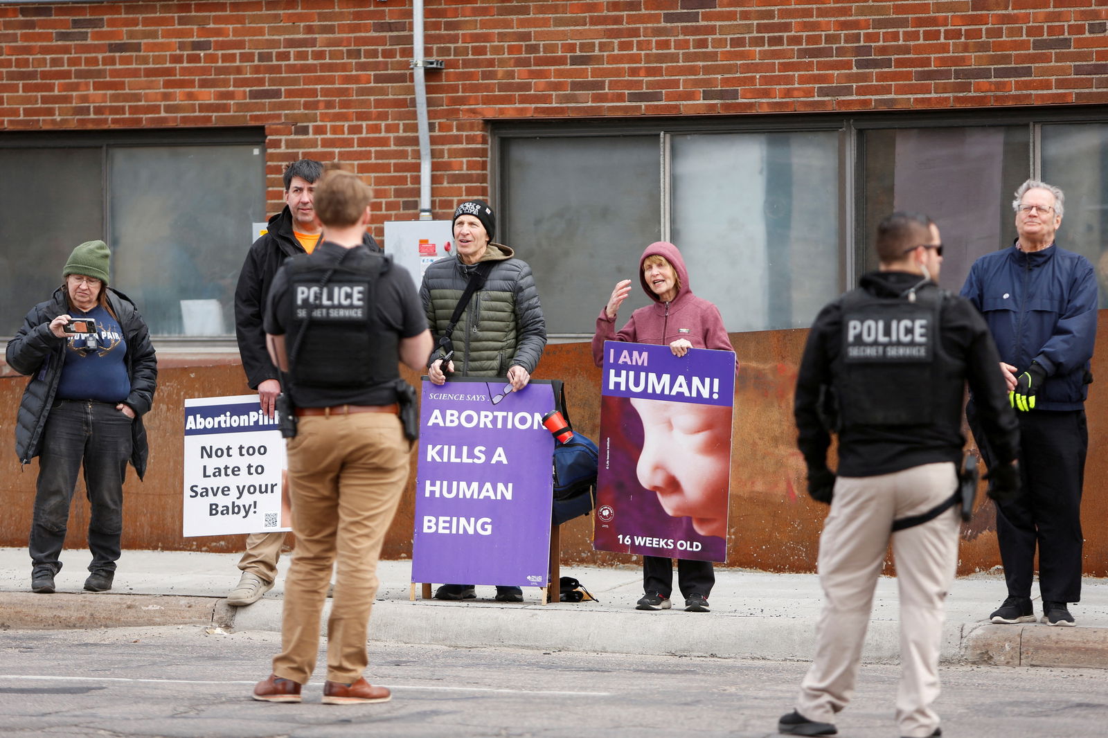 People demonstrate against abortion as U.S. Vice President Kamala Harris visits the St. Paul Health Center, a clinic that performs abortions, in St. Paul, Minnesota, U.S., March 14, 2024. 