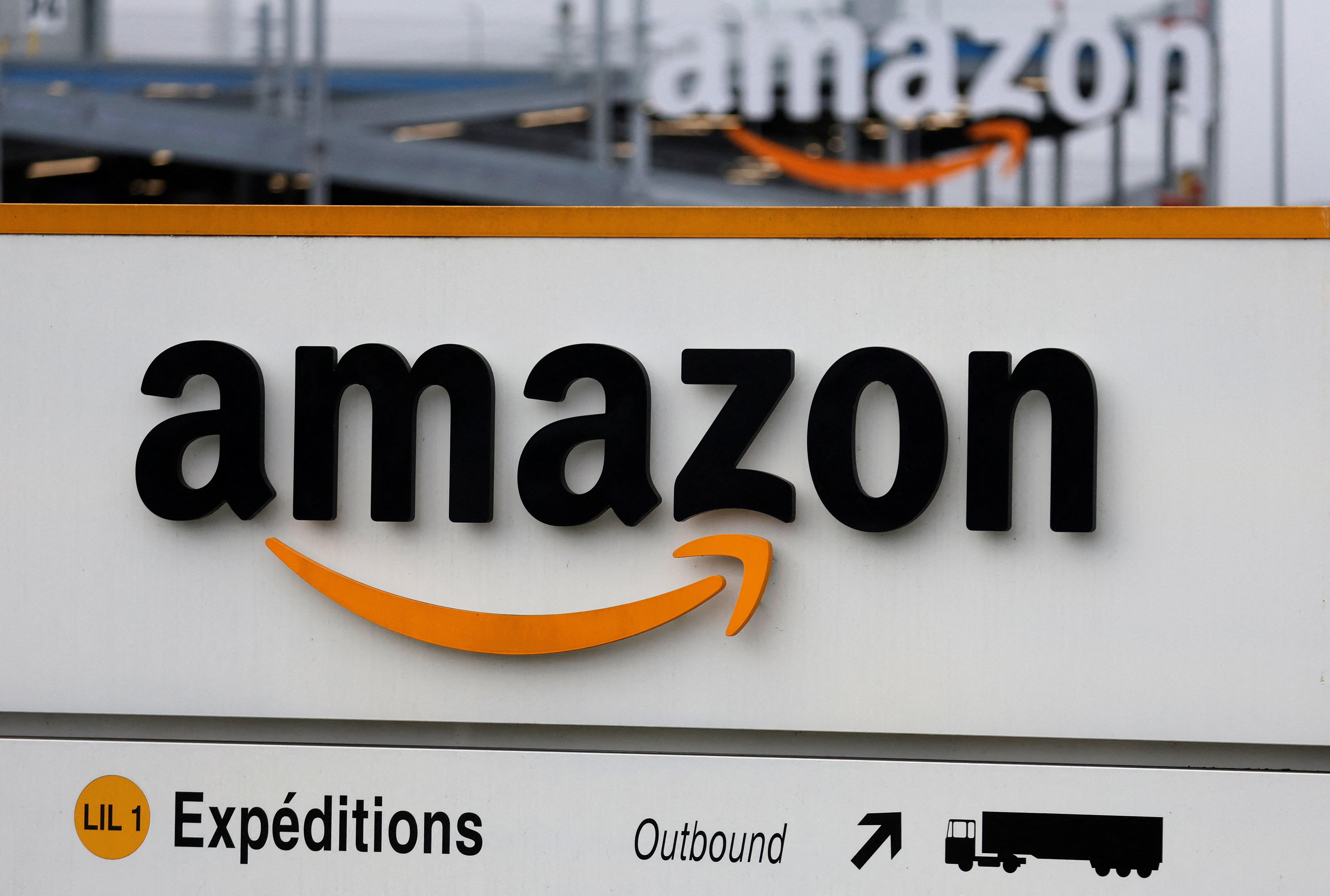 FILE PHOTO: The logo of Amazon is seen at the company logistics center in Lauwin-Planque, northern France, January 5, 2023. 