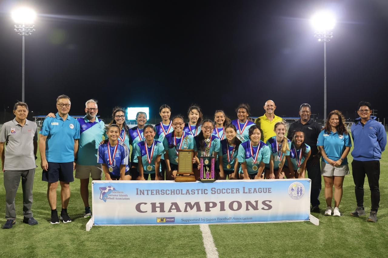 Saipan International School poses with the girls high school division championship trophy of the NMIFA-PSS Interscholastic Soccer League SY23-24 during the awards ceremony at the NMI Soccer Training Center in Koblerville on Thursday.