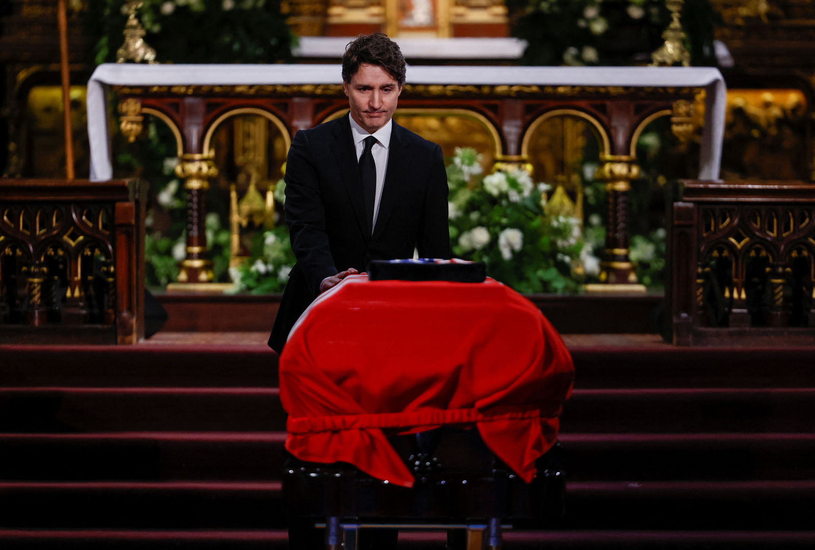 Canadian Prime Minister Justin Trudeau pays his respects at the coffin of late former Canadian Prime Minister Brian Mulroney, who died on February 29 at the age of 84, during his state funeral at the Notre-Dame Basilica of Montreal, Quebec, Canada March 23, 2024. 
