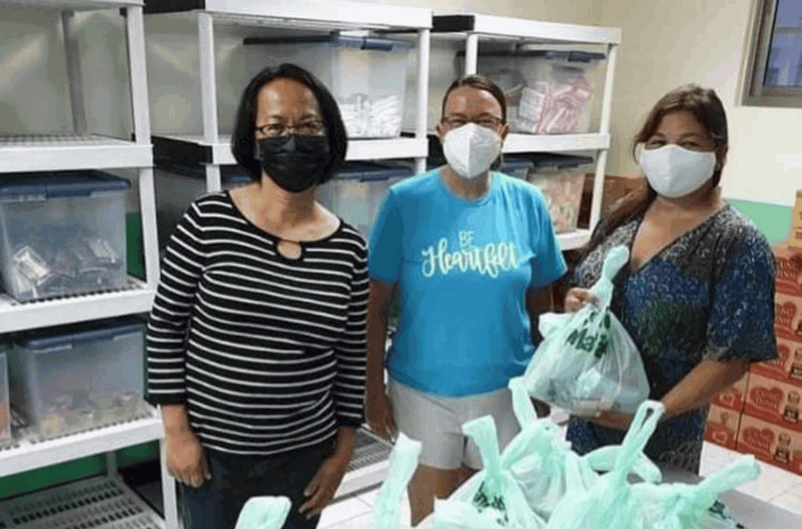 Be Heartfelt CEO and founder Lori Marble, center, is pictured with volunteers in January 2022. 