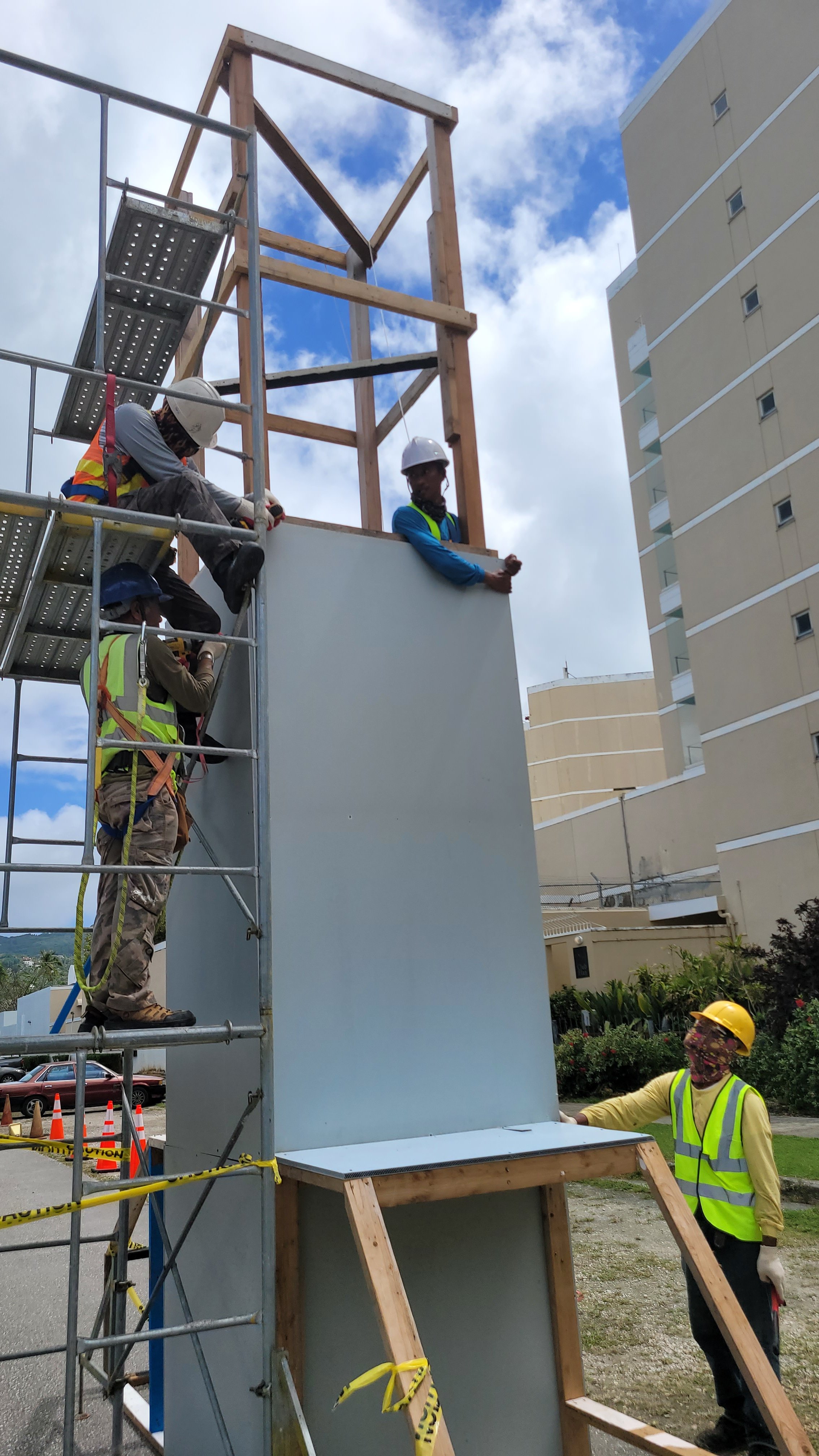 Workers build the start/finish line arch at American Memorial Park for the Skechers Saipan Marathon 2024 on March 9, 2024.  Nearly 500 runners have registered for the event, with all courses this year on Chalan Pale Arnold or Middle Road from Oleai to Marpi. The outer southbound lane will be closed to traffic during the race.