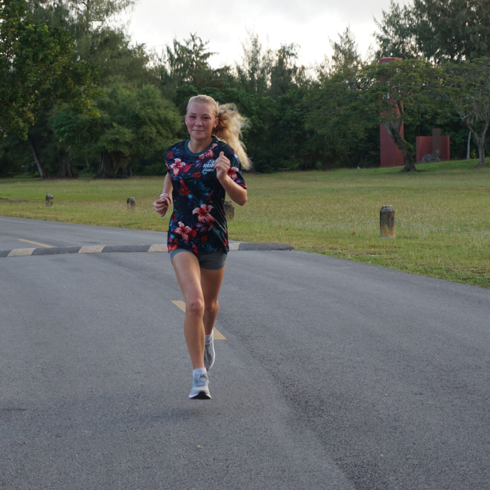 Addalee Taflinger smiles as she approaches the finish line of Run Saipan’s 4th Annual Mangrove 5K at American Memorial Park on Saturday.